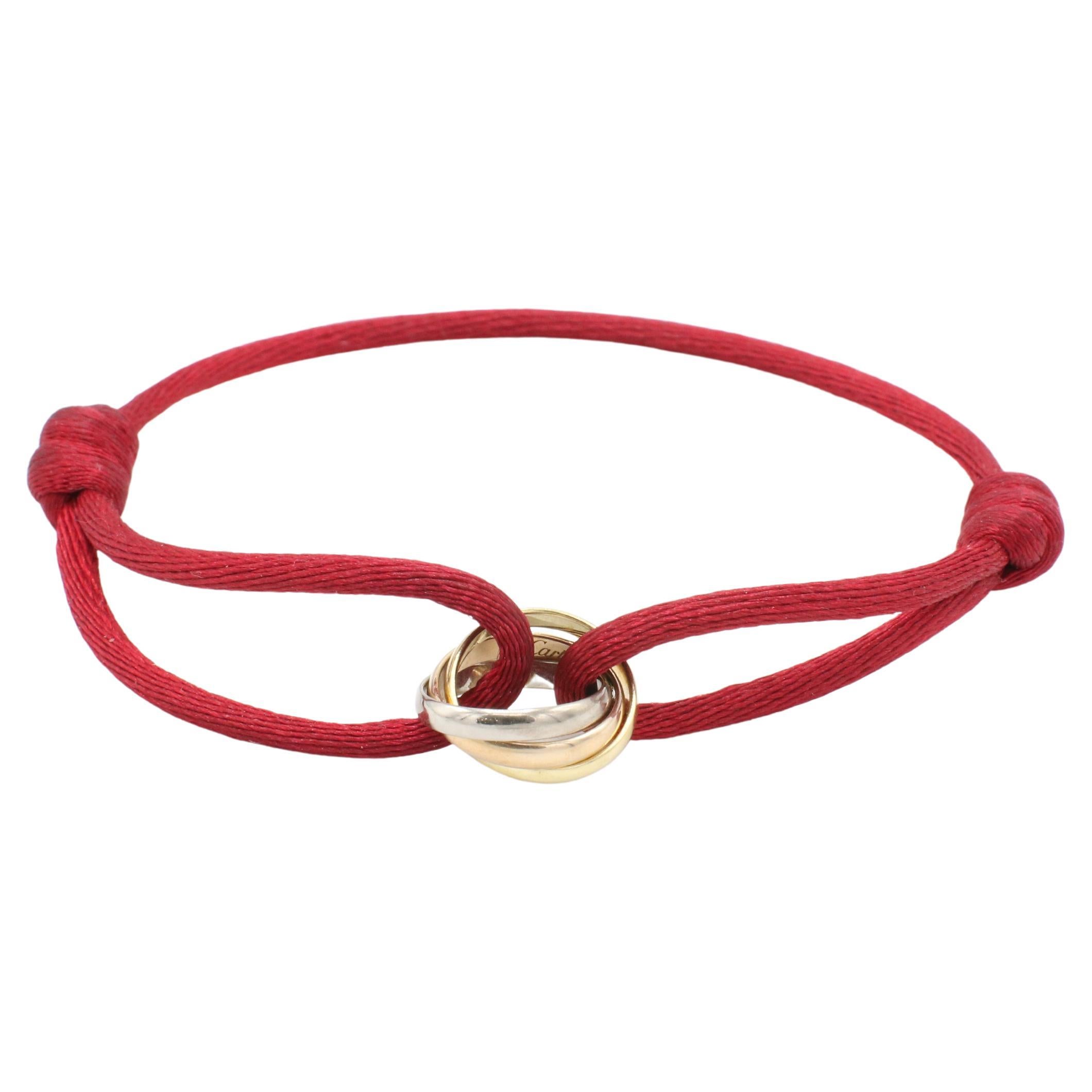 Cartier Trinity Tri-Color Rolling Bracelet on Adjustable Red Cord Box & Papers
Metal: 18k white, yellow & rose gold
Weight: 2.94 grams
Inner diameter: 10.7 mm
Width: Bands are 2mm each
Length: Fits a wrist 5.25 - 9 inches (adjustable)
Retail: $960