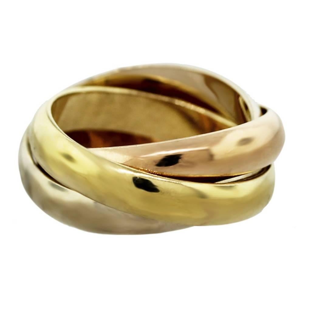 This Cartier Trinity Ring is the classic three band rolling ring. 
Cartier Trinity de Cartier Tri-Color 18k Gold Ring
Ring Size	Size 9
Materials	18k Yellow Gold, White Gold and Rose Gold
Measurements	Each ring is approx. 4mm wide
Total Weight	9.5dwt