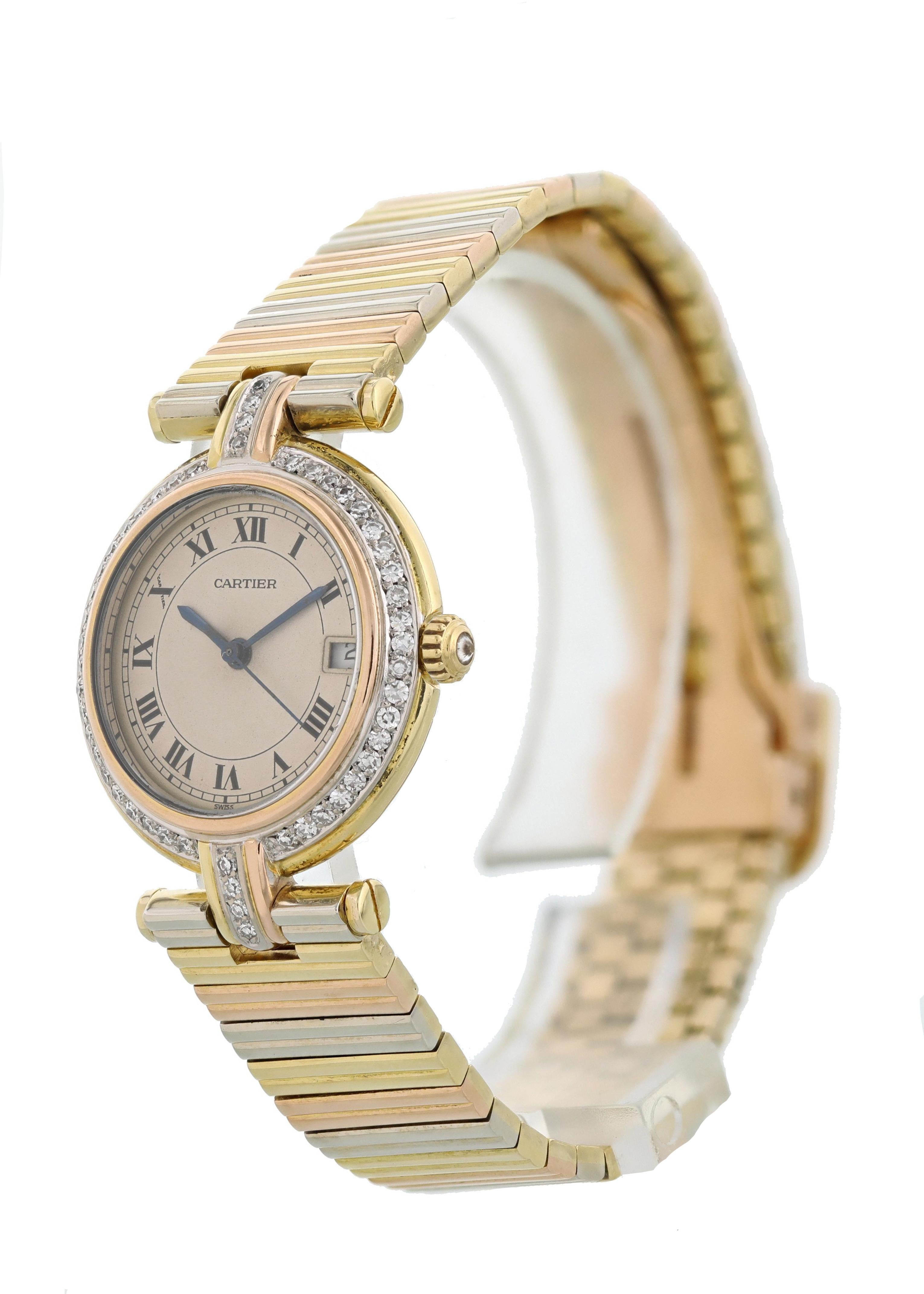 Cartier Trinity Vendome 18k Ladies Watch. 26mm 18 yellow gold case with Factory placed diamonds and a rose gold bezel. Off white dial with blue steel hands and Roman numeral hour markers Minute markers around the outer dial. Date display at the 3