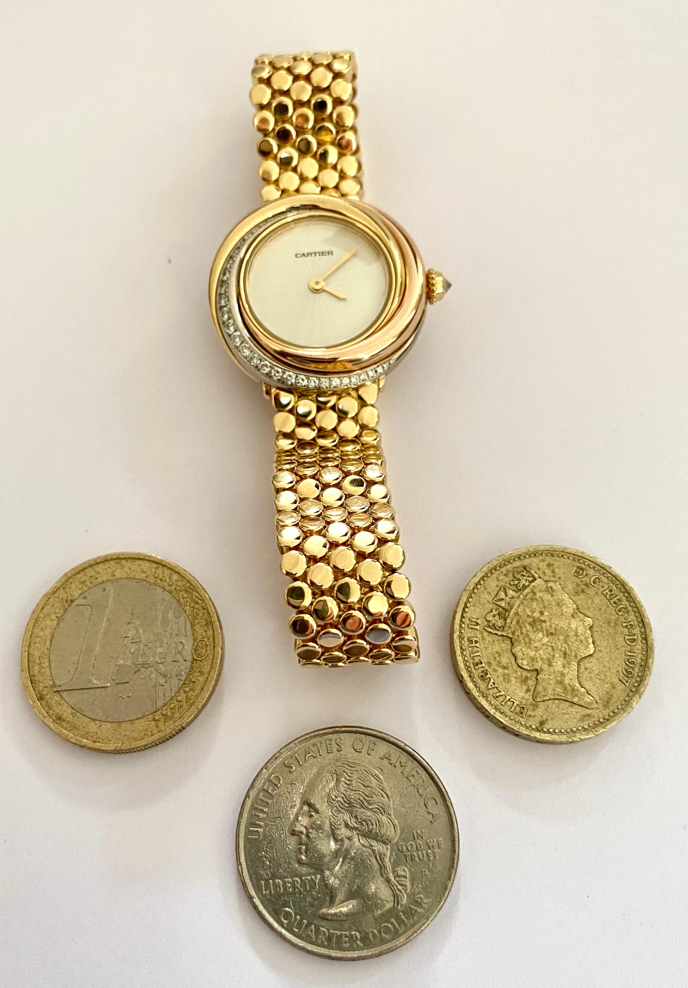 Cartier, Trinity Watch in 18 Karat Gold 33 Diamonds and a 18 Karat Gold Bracelet 3