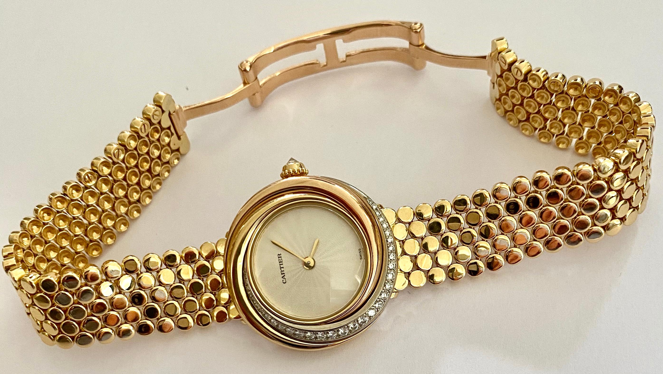 Art Deco Cartier, Trinity Watch in 18 Karat Gold 33 Diamonds and a 18 Karat Gold Bracelet