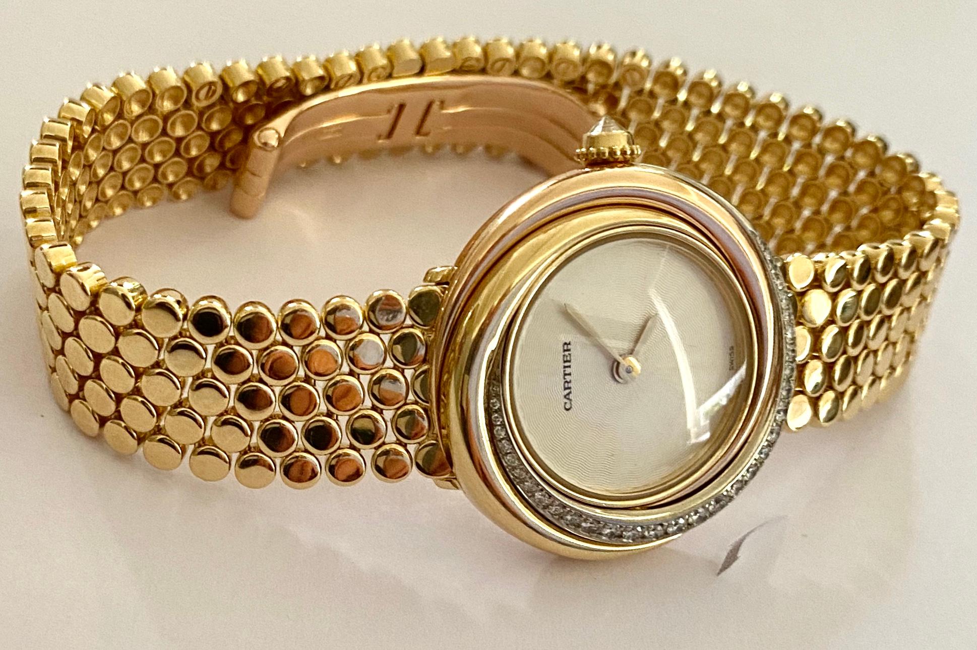 Women's Cartier, Trinity Watch in 18 Karat Gold 33 Diamonds and a 18 Karat Gold Bracelet