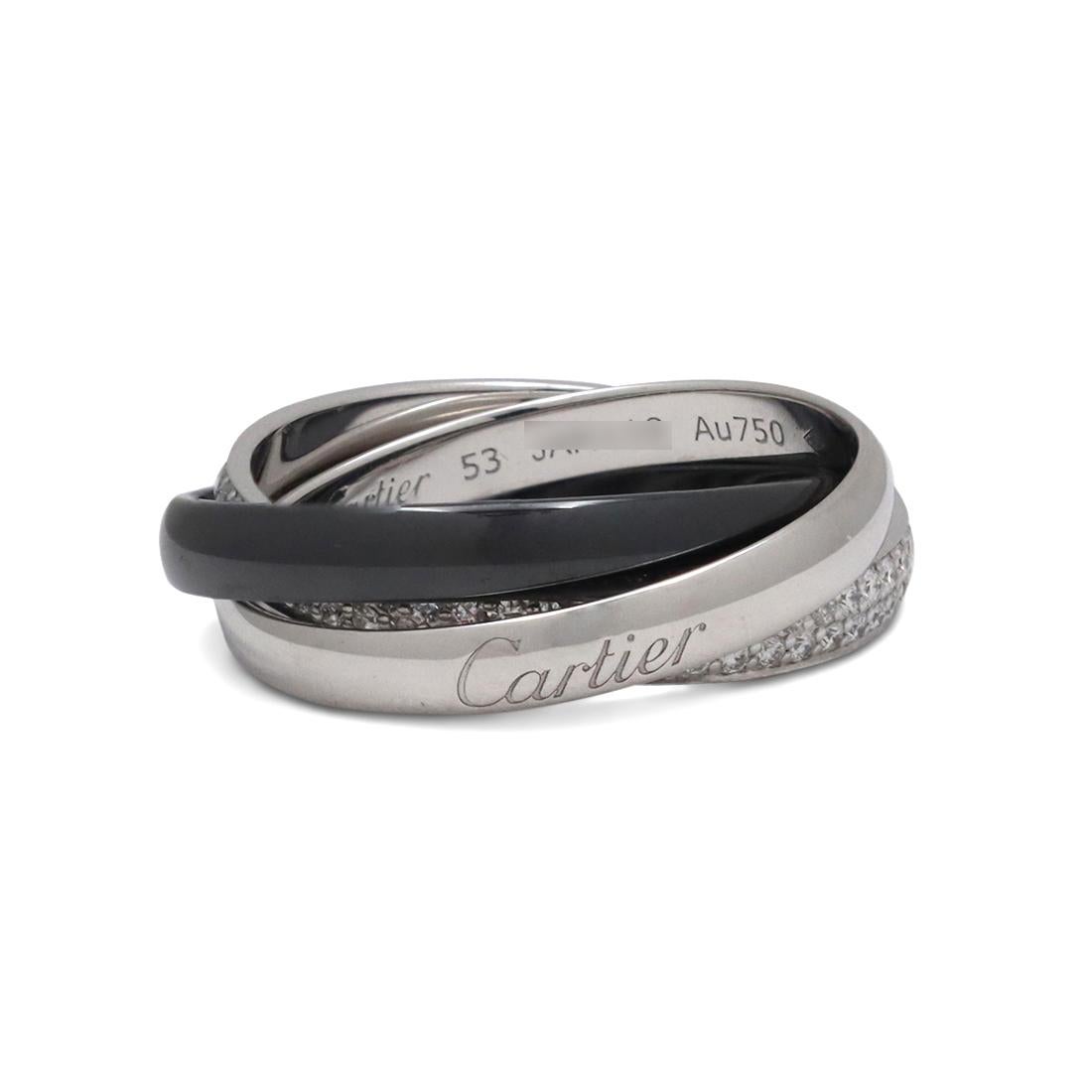 Authentic Cartier 'Trinity' ring comprised of interlocking bands of 18 karat white gold and black ceramic. One white gold band is pave set with an estimated 1 carat of high quality (G-H color, VS clarity) diamonds. Each band measures 3.3 mm in