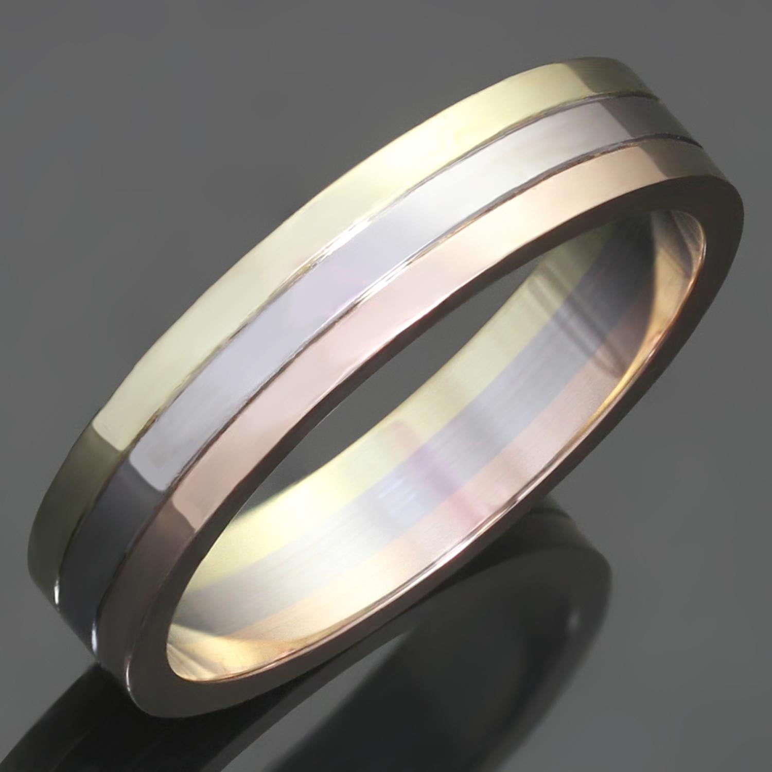 This gorgeous wedding band from Cartier's iconic Trinity collection is crafted in 18k yellow, white, and rose gold. gold, 18K white gold. Made in France circa 2010s. Measurements: 0.19