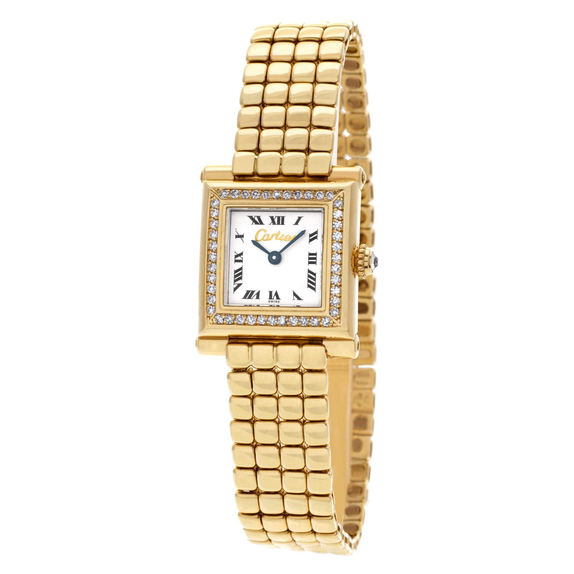 Ladies Elegant Limited Edition Cartier Trocadero in 18k yellow gold with Cartier original diamond bezel and crown. Quartz. Fits 7 inches wrist. 20mm case size. Circa 2000s. Fine Pre-owned Cartier Watch.  Certified preowned Cartier Trocadero watch is