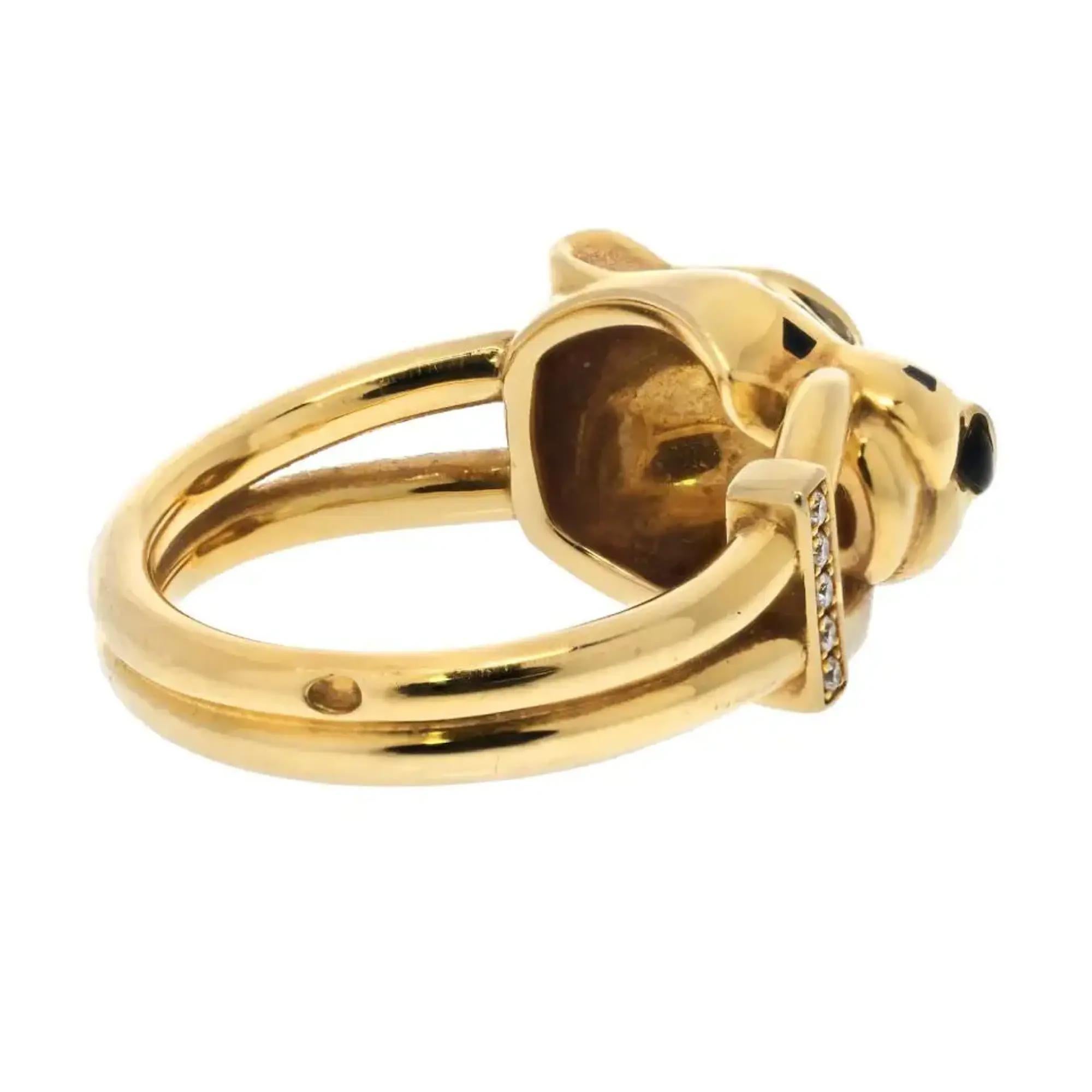 Cartier's Panthere de Cartier ring, crafted in 18K yellow gold, set with 5 round brilliant-cut diamonds totaling 0.02 carat. Also set with gemstones, tsavorite garnets, onyx and black lacquer. Width of the pattern: 10.7 mm. Ring Size 52 US 6.