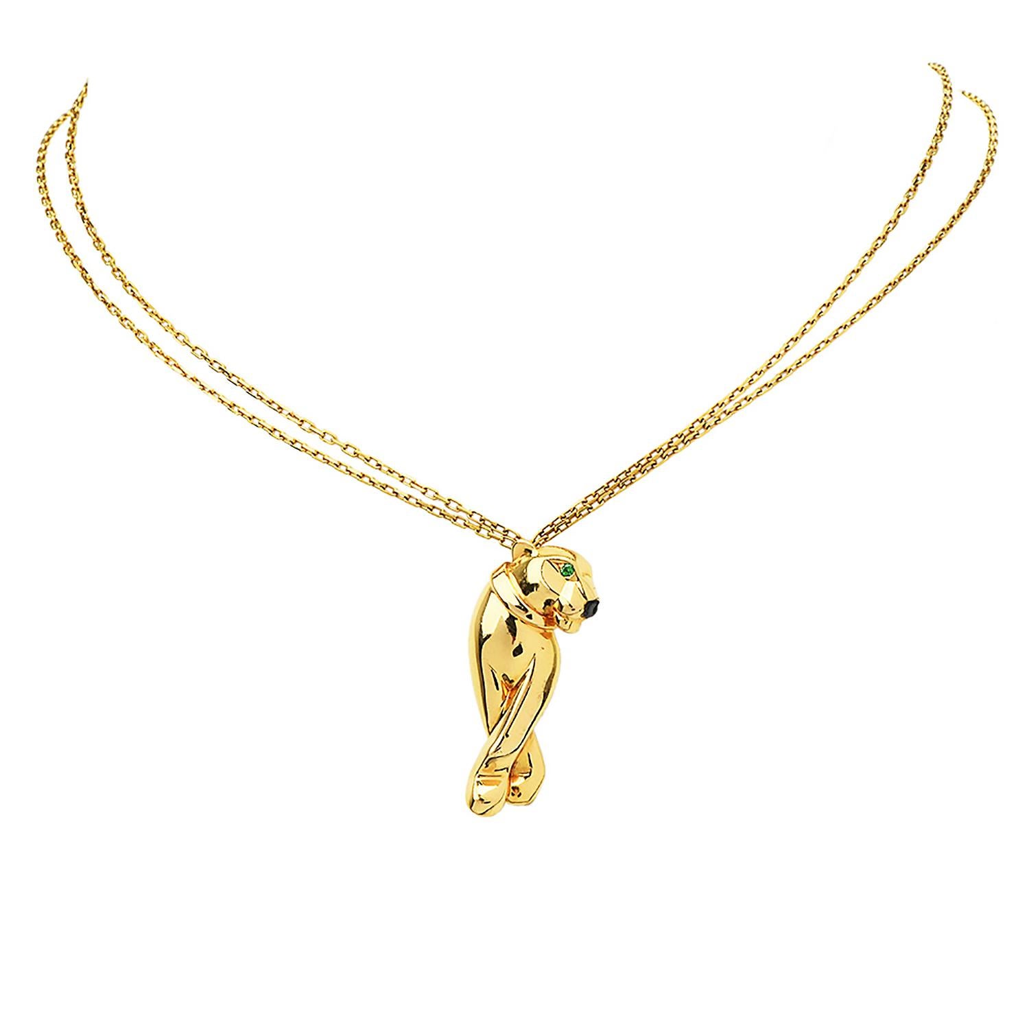 Panthere de Cartier is an exquisite piece inspired by the classic panther face design, pendant & Necklace.

Crafted in solid 18K Yellow Gold, the eyes are made of 2 Tsavorites, round-cut weighing collectively 0.03 carats.

The nose is created