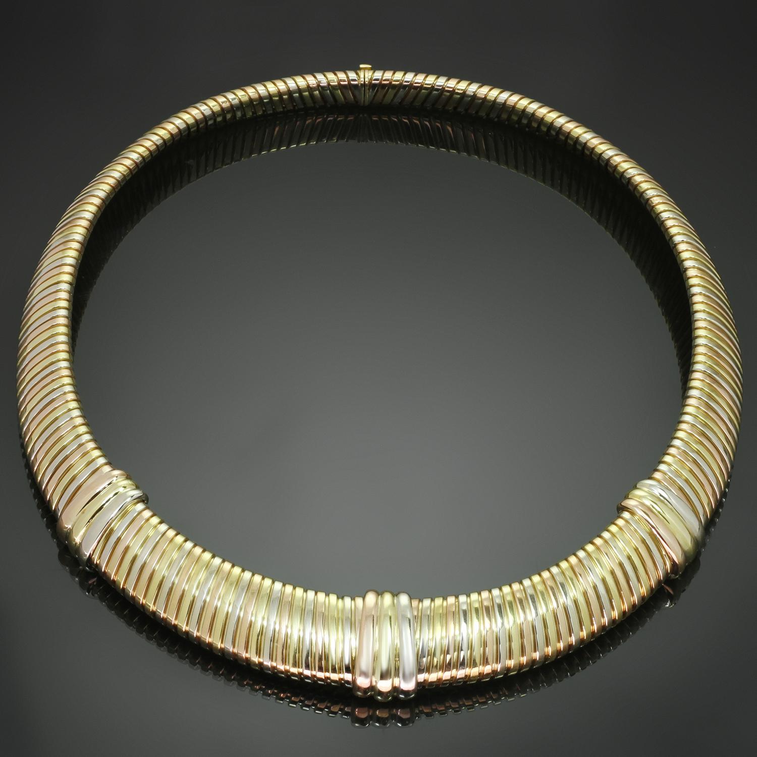 This gorgeous Cartier Trinity collar necklace reminiscent of the iconic Tubogas collection features a fluid link design crafted in 18k yellow, white, and rose gold. Made in France circa 1980s. Measurements: 0.51