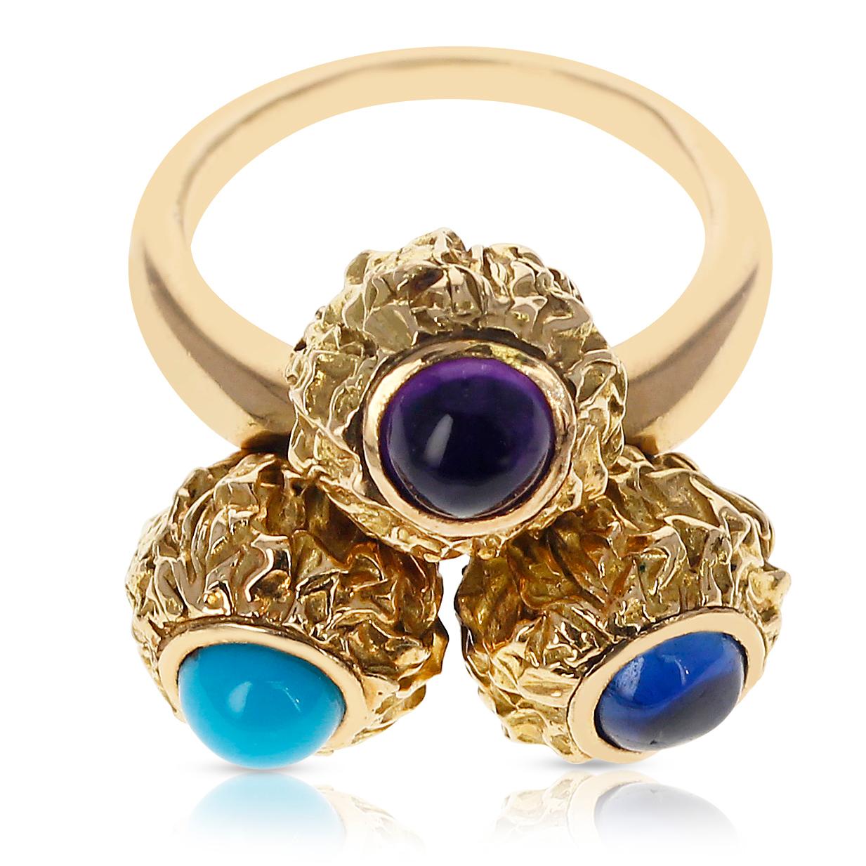 A beautiful Cartier Turquoise, Amethyst, Sapphire Cabochon Trio Ring made in 18 Karat Yellow Gold. The gold is textured. Total Weight: 12.39 grams. Ring Size: 5.25