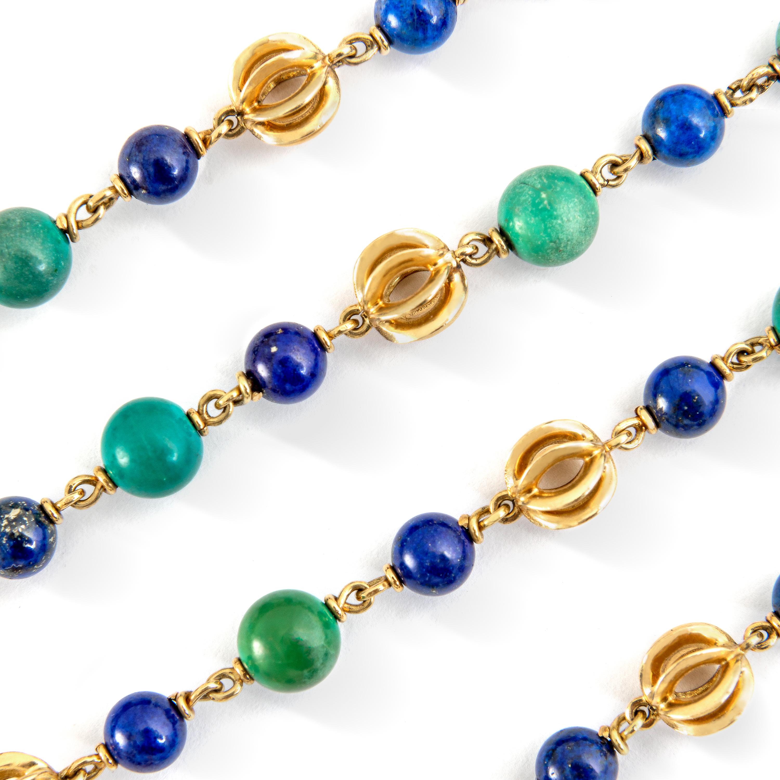 Turquoise and Lapis Lazuli beads alternating yellow gold 18k designed elements compose this Sautoir Necklace.
Signed Cartier. Maker's mark, Numbered. 
Circa 1970.
Total length: 35.43 inches (90.00 centimeters).