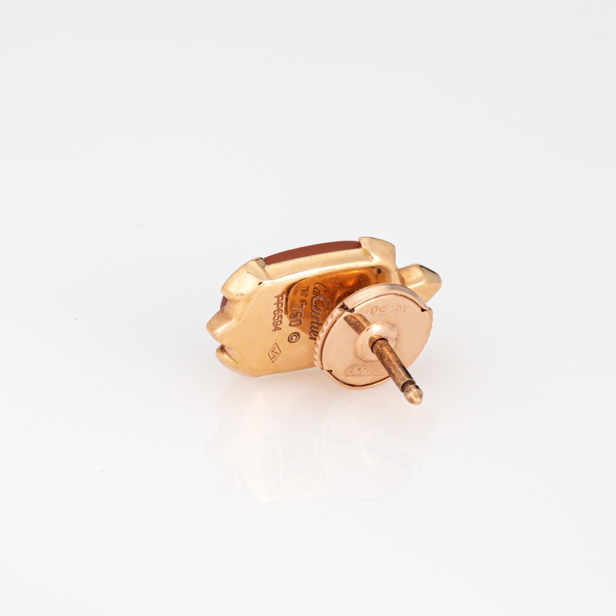 Stylish estate Cartier lapel pin crafted in 18k rose gold (circa 2012).  

Chalcedony measures 10mm x 7.5mm. One small diamond is estimated at 0.01 carats (estimated at F-G color and VS1 clarity). The chalcedony is in very good condition and free of
