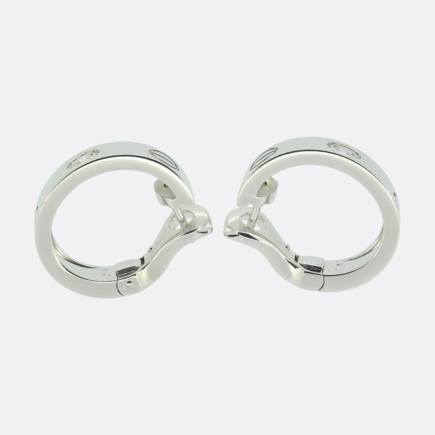 Here we have an stylish pair of diamond hoop earrings from the world renowned jewellery house of Cartier. Each identical piece has been crafted from 18ct white gold and features the iconic screw motif alongside a single bright white round