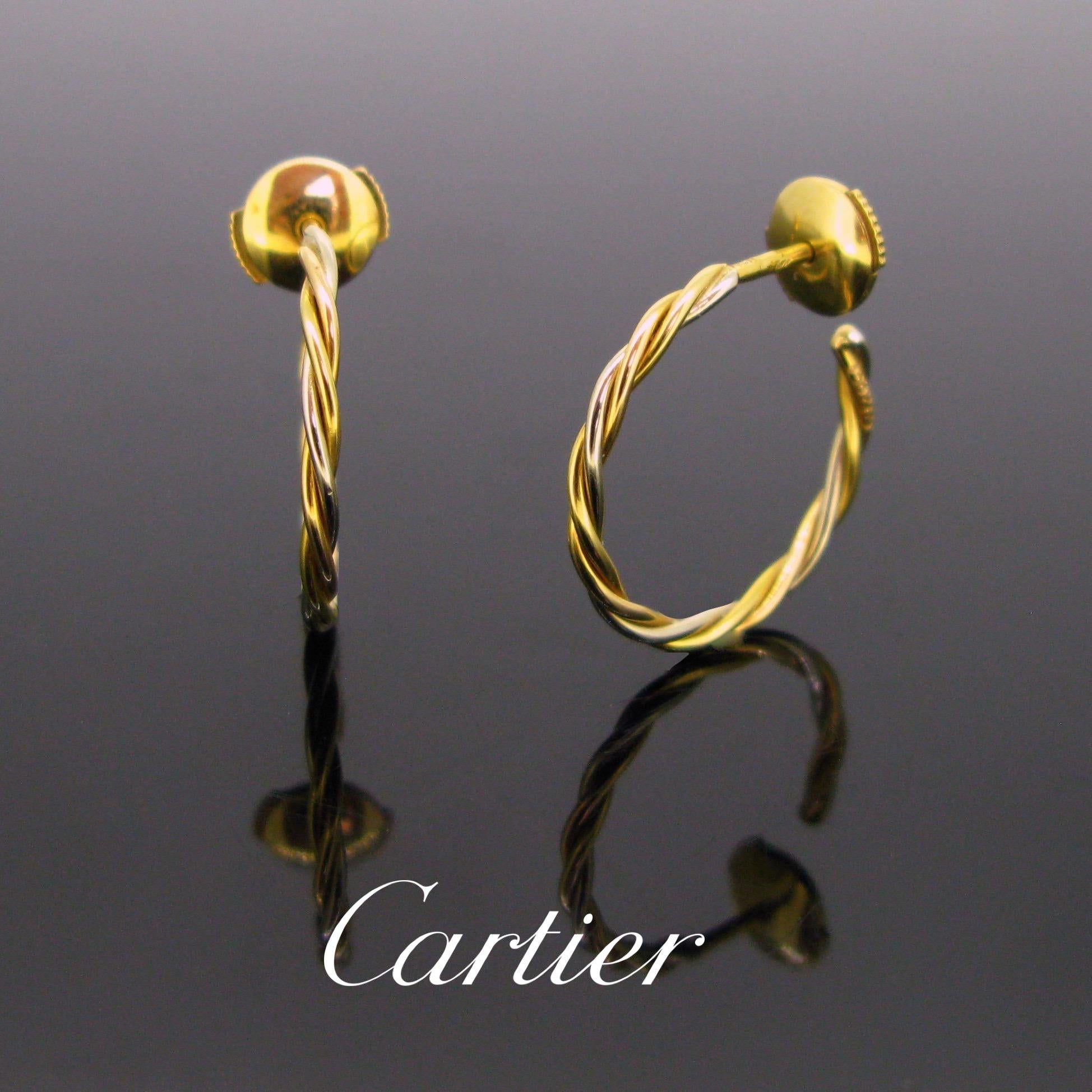 These hoop earrings are made in 18kt yellow and white gold. They are signed Cartier Paris and numbered 158265. These are very easy to wear for everyday. They are in very good condition. 

Circa: 1990

Weight: 3.8gr

Metal: 18kt white and yellow