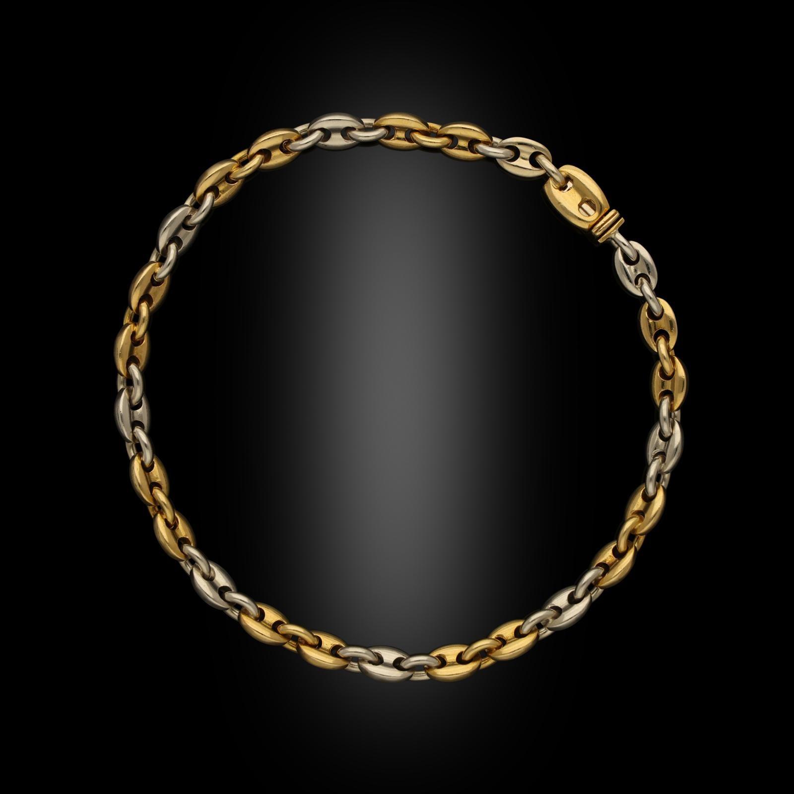 A classic 18ct gold Mariner long chain necklace by Cartier, circa 1990s, the two-tone gold necklace formed of uniform mariner links in a pattern of two yellow gold and one white gold repeated along the length, the long chain necklace separates to