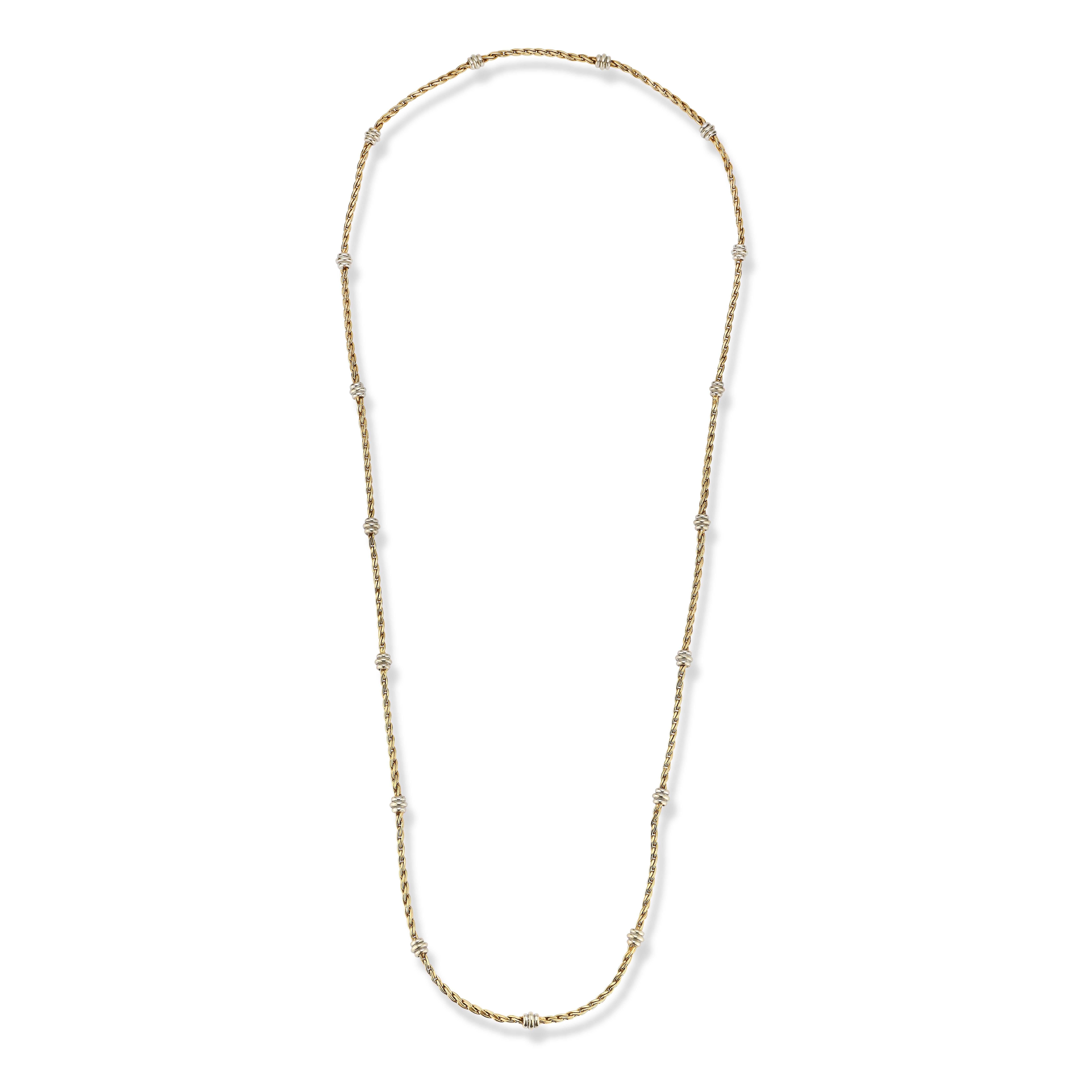 Cartier Two Tone Gold Necklace

A two tone gold necklace with 17 white gold knots evenly spaced throughout

Signed Cartier 

Length: 33