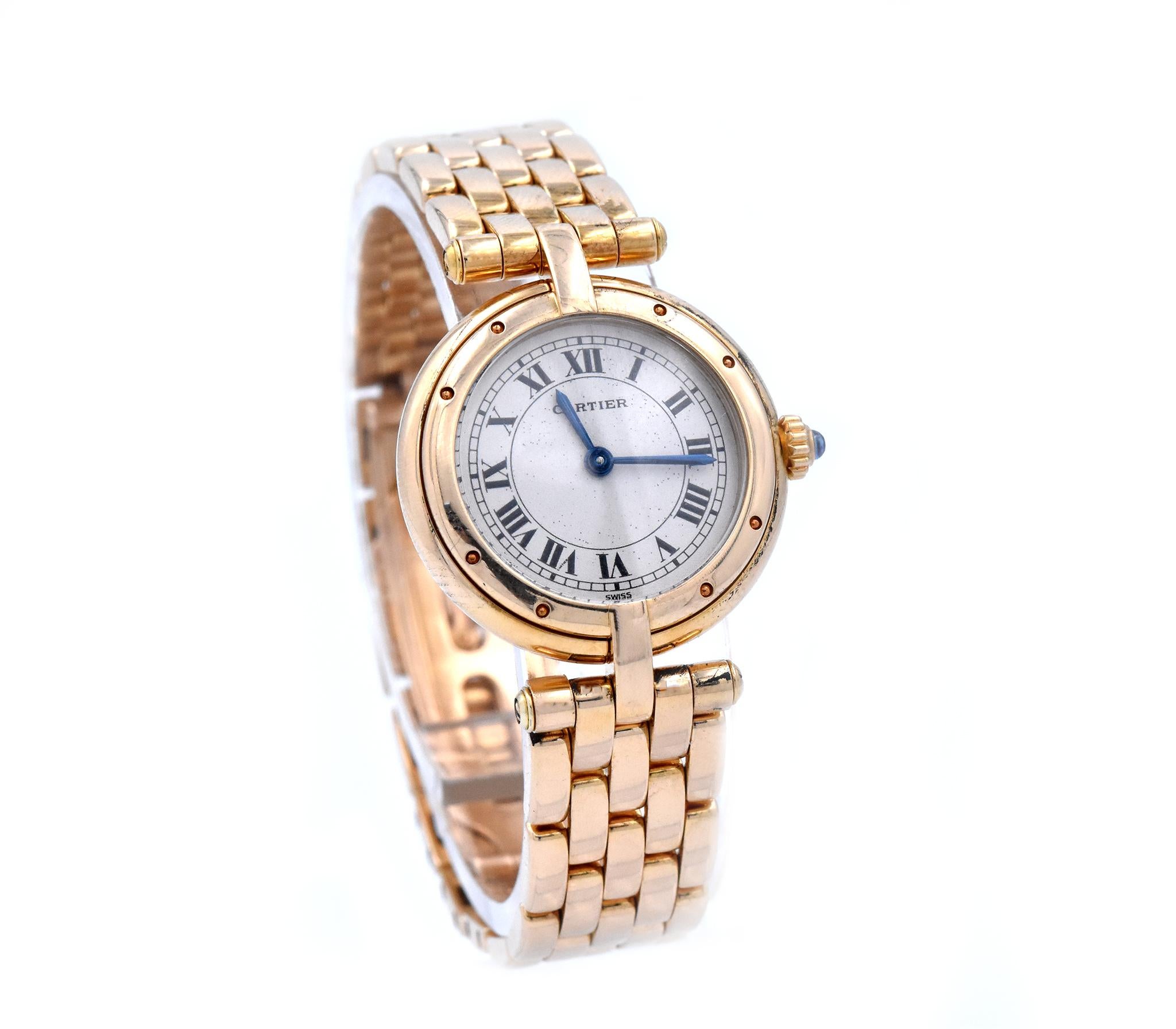 Movement: quartz
Function: hours, minutes
Case: 23.5mm circular case, push pull crown, sapphire crystal
Dial: white dial, blue steeled hands, roman numeral hour markers
Band: yellow gold Cartier link bracelet with butterfly clasp
Serial #: