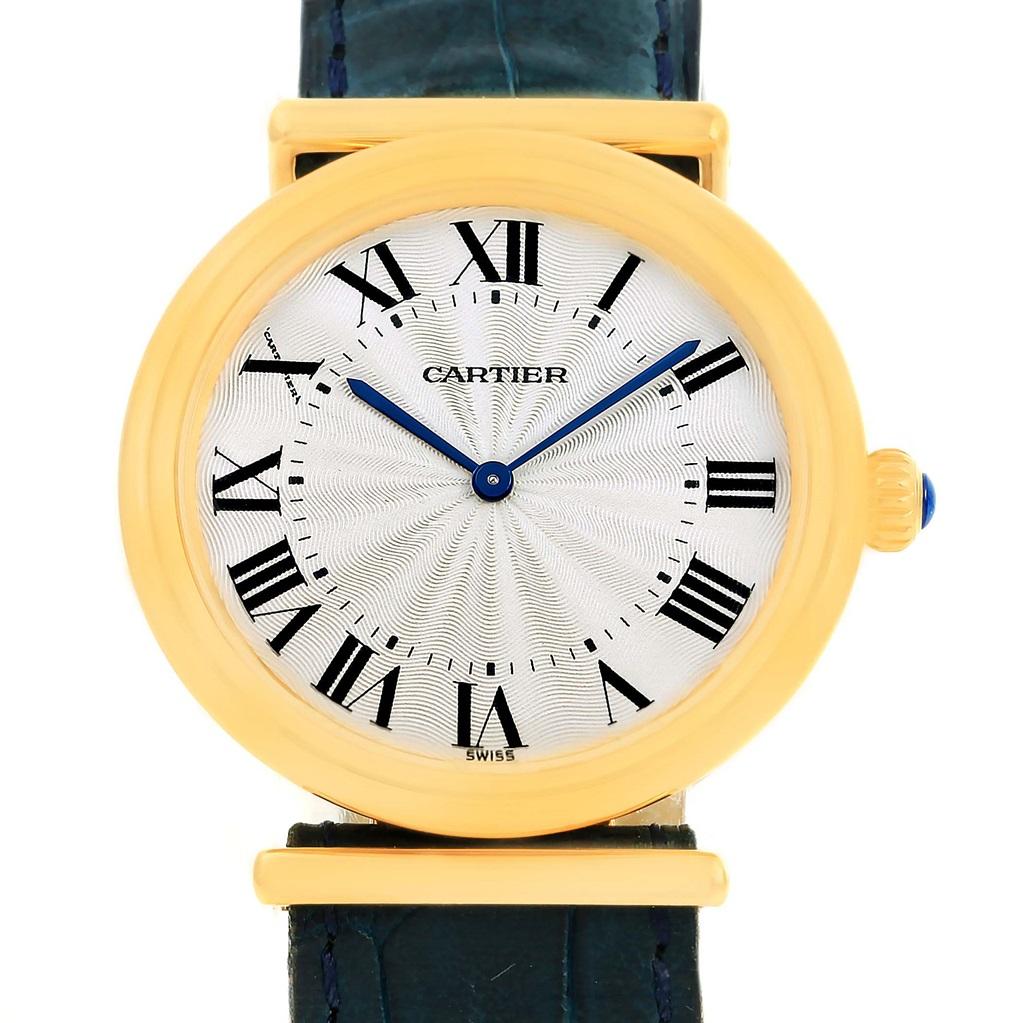 Cartier Vendome BiPlan 18K Yellow Gold Blue Strap Watch W1514457. Manual winding movement. 18K yellow gold round ribbed case 32.0 mm in diameter. Circular grained crown set with the blue sapphire cabochon. Deployent buckle integrated to caseback.