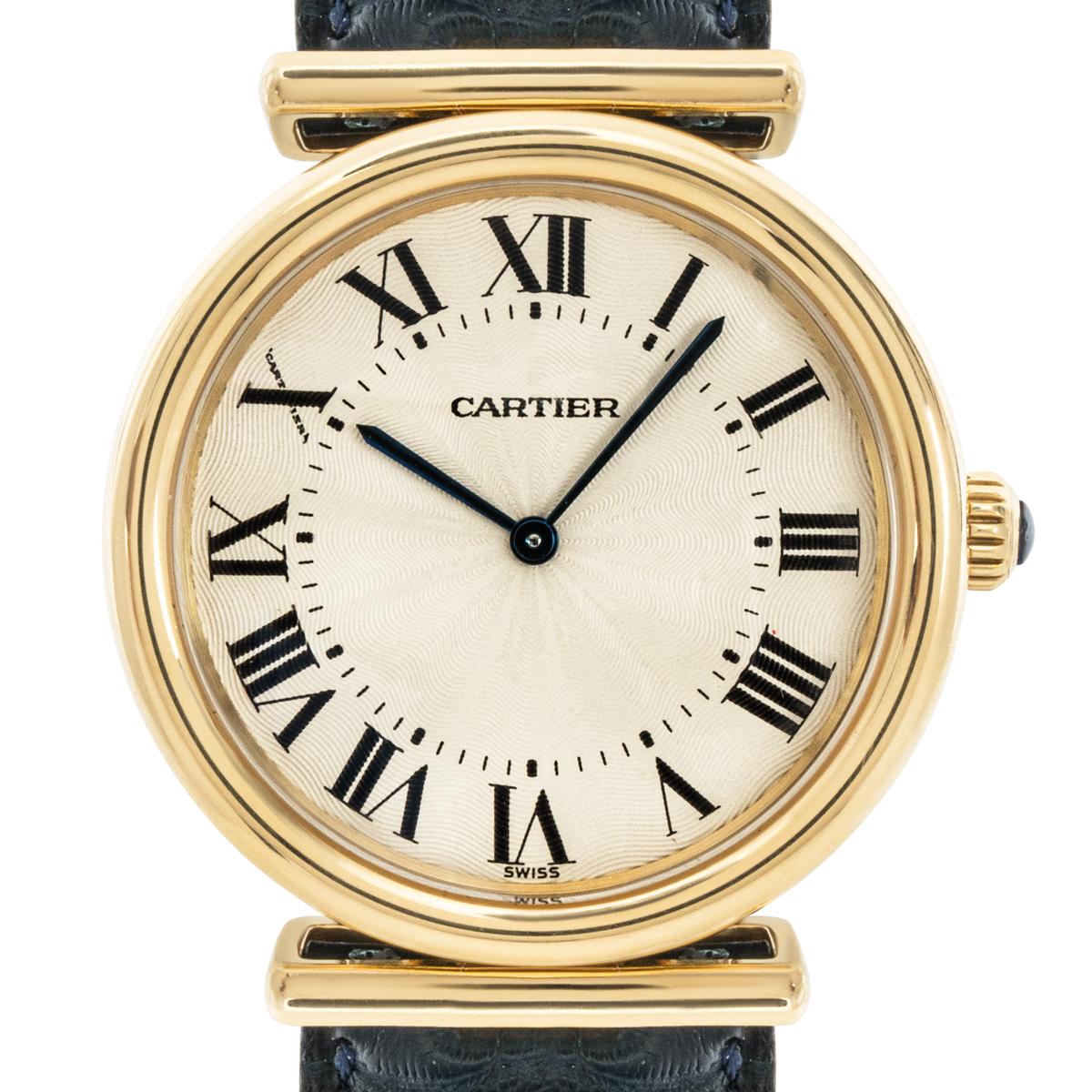 A yellow gold Vendome Bi-Plan wristwatch by Cartier. Featuring a silver guilloche dial with roman numerals, a secret Cartier signature at 