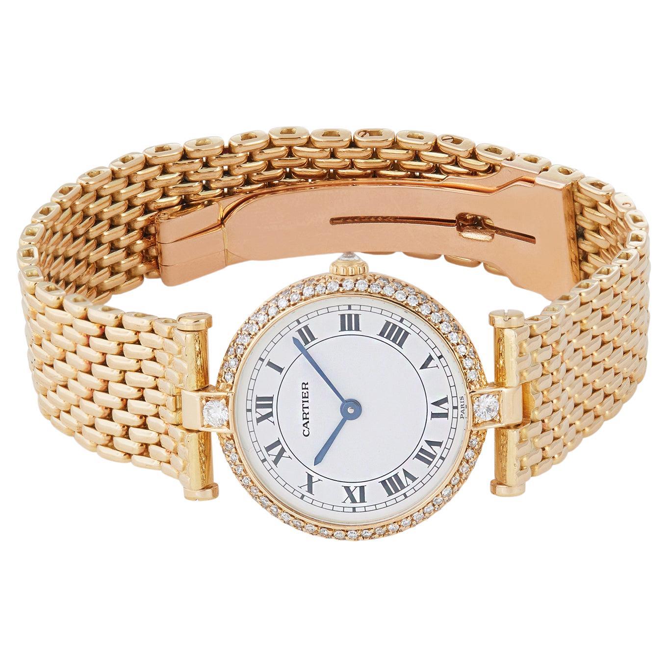 Authentic Vendome de Cartier watch crafted in 18 karat yellow gold with matching mesh bracelet and hidden deployant clasp. The round case diameter measures 24 mm.  Features a white dial with black Roman markers, and a bezel set with single and round