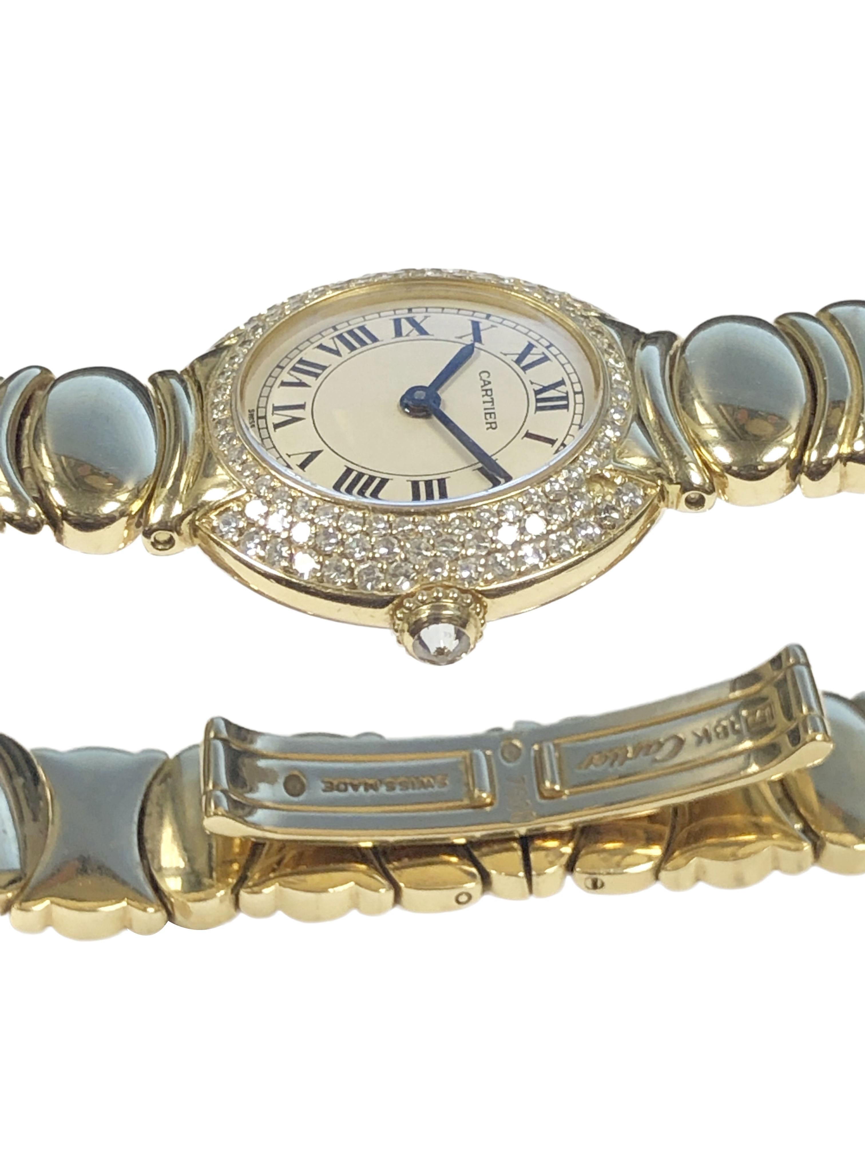 Circa 1990 Cartier Reference WN100207 Vendome Boutique Ladies Wrist watch, 26 X 25 M.M. 18k Yellow Gold 2 piece water resistant case set with 107 Round Brilliant cut Diamonds totaling 1.03 Carats. 1/2 inch wide Casque d'or Bracelet with fold over