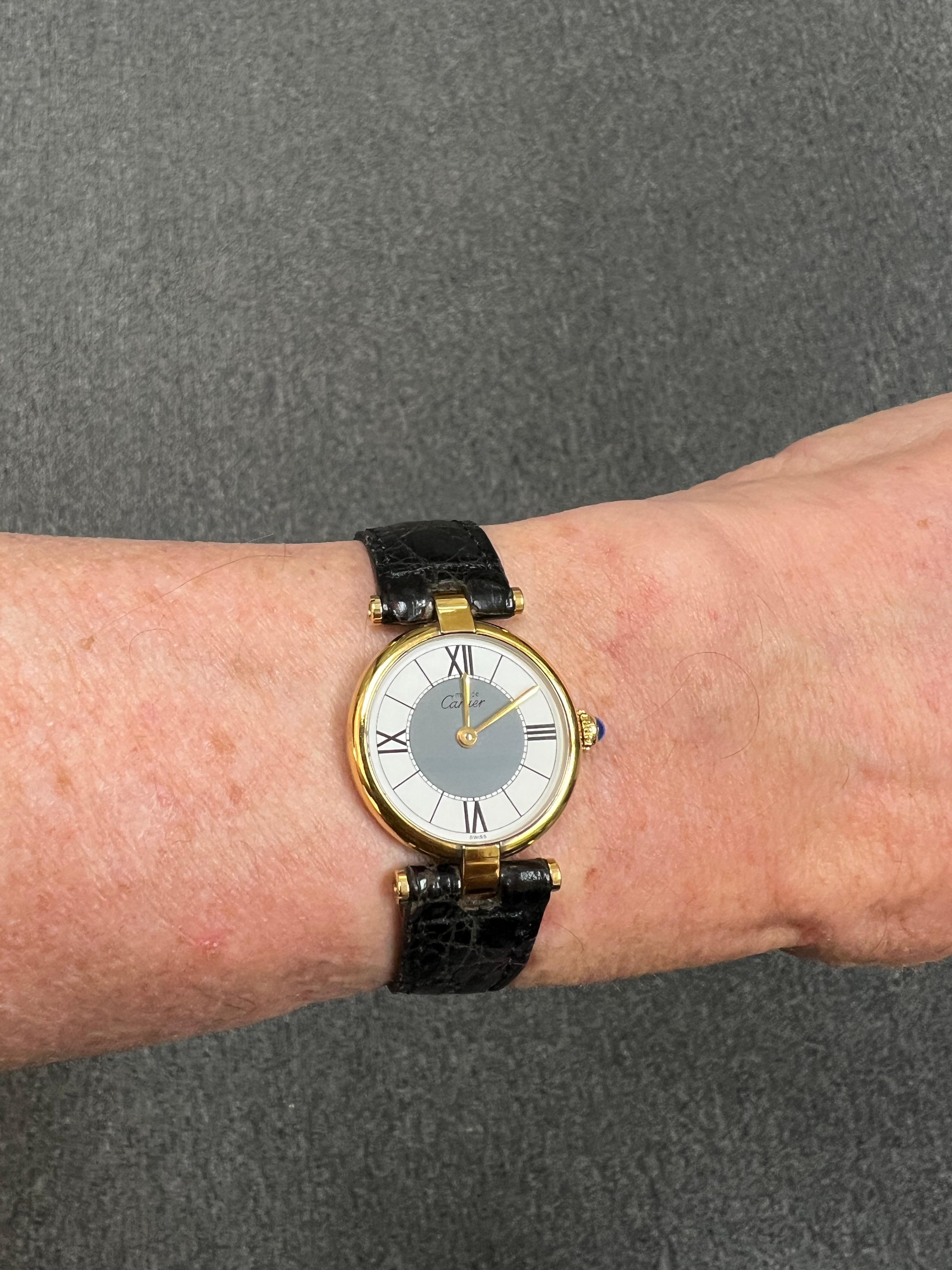 Cartier Vendome Must de Cartier Quartz vermeil wristwatch, circa 1990s.

The Cartier Vendome Must de Cartier quartz vermeil wristwatch from the 1990s has a two-tone dial, white and dark grey, with four Roman numerals and 8 markers.  All in very good