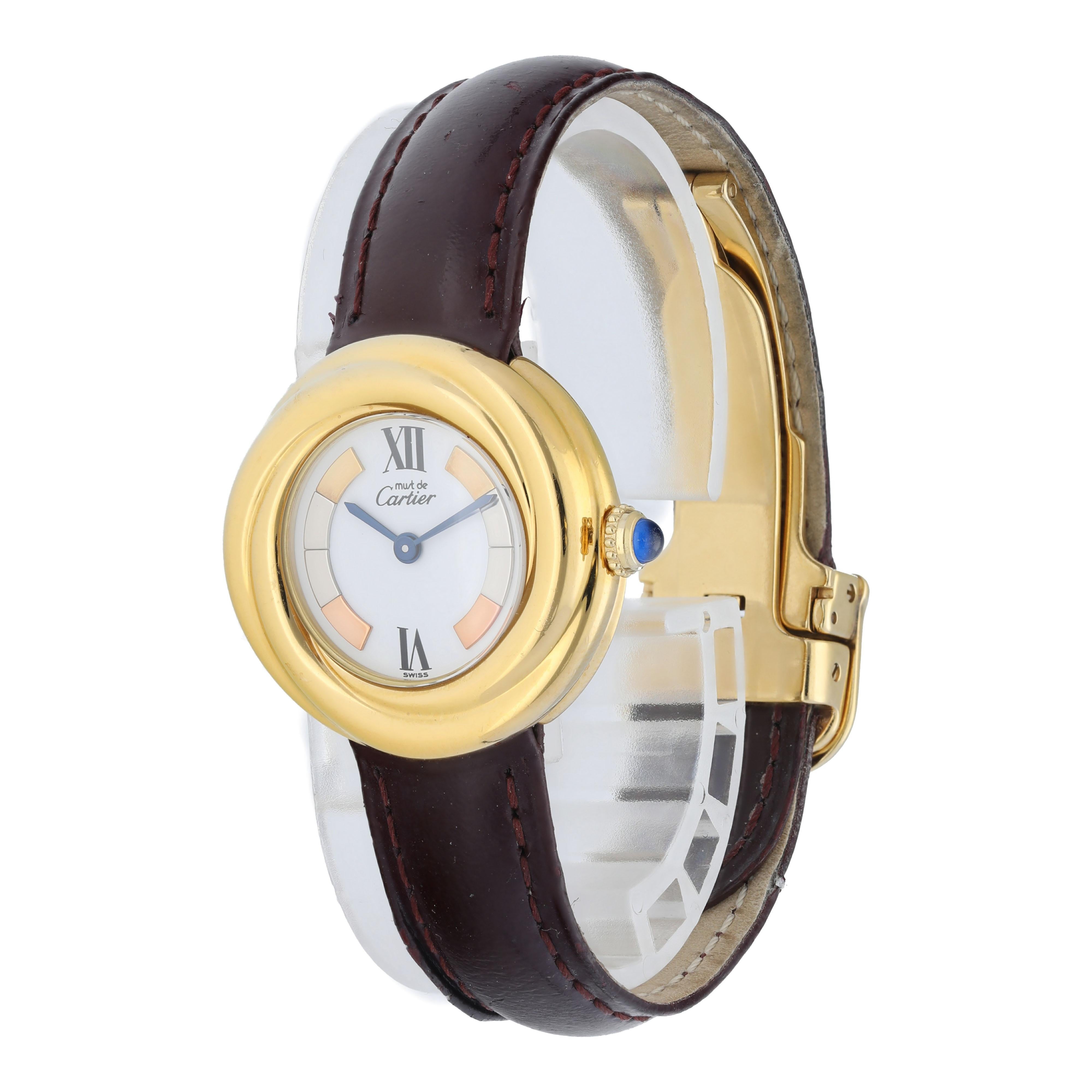 Cartier Vermeil 2735 Must de Cartier Ladies Watch. 
27mm Gold Plated case. 
Gold Plaited smooth bezel. 
Off-White Trinity Color dial with Blue steel hands and Roman numeral hour markers. 
Burgundy Leather Strap with Deployment Buckle. 
Will fit up
