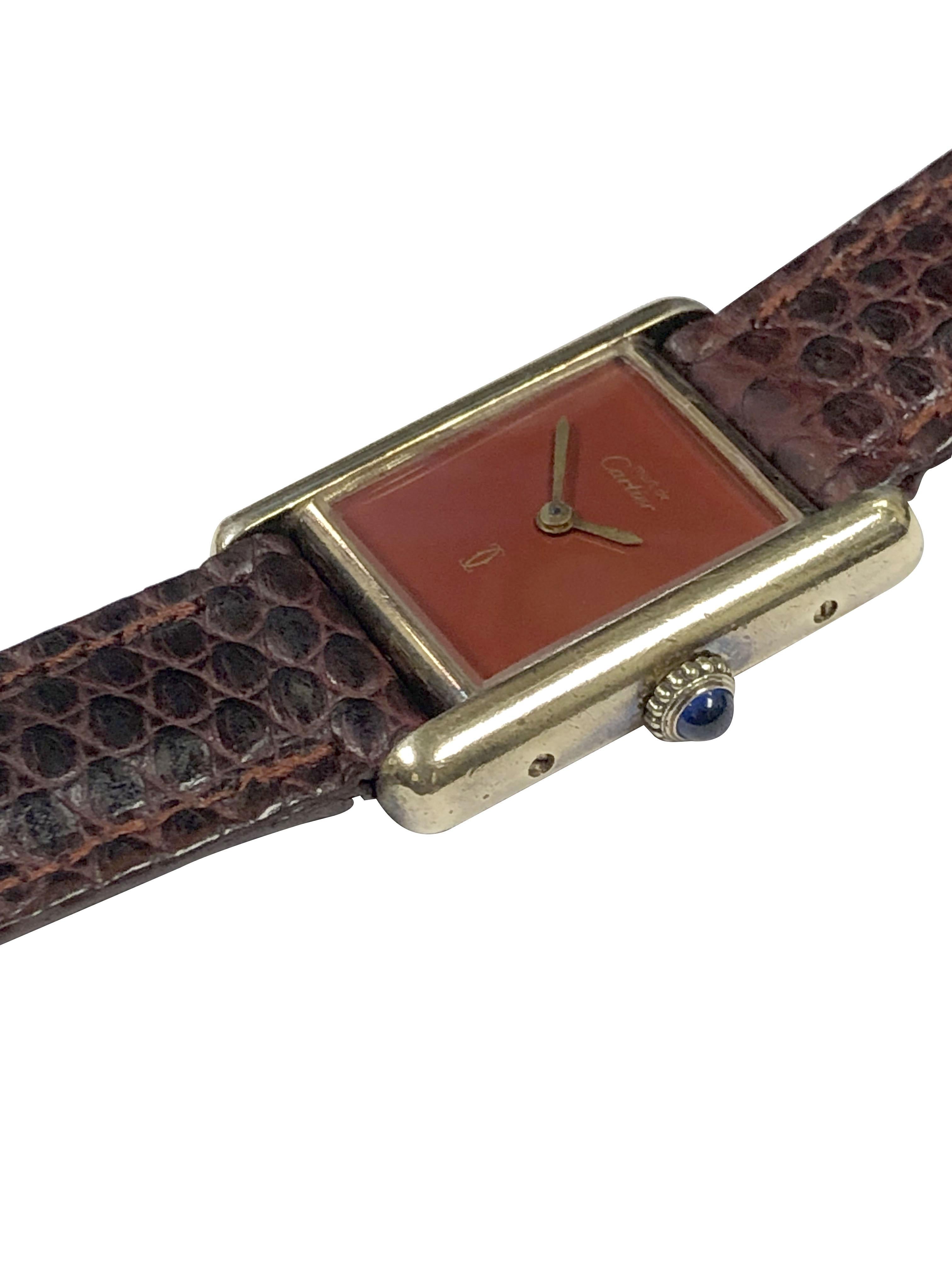 Circa 1980s Cartier Must De Cartier Tank Wrist Watch, 19 x 20 M.M. 2 Piece Gold Plate on Sterling Silver, Burgundy - Red, Enamel Dial. 17 Jewel Mechanical, Manual wind movement. original Burgundy Lizard strap with Gold plate Cartier Tang Buckle.