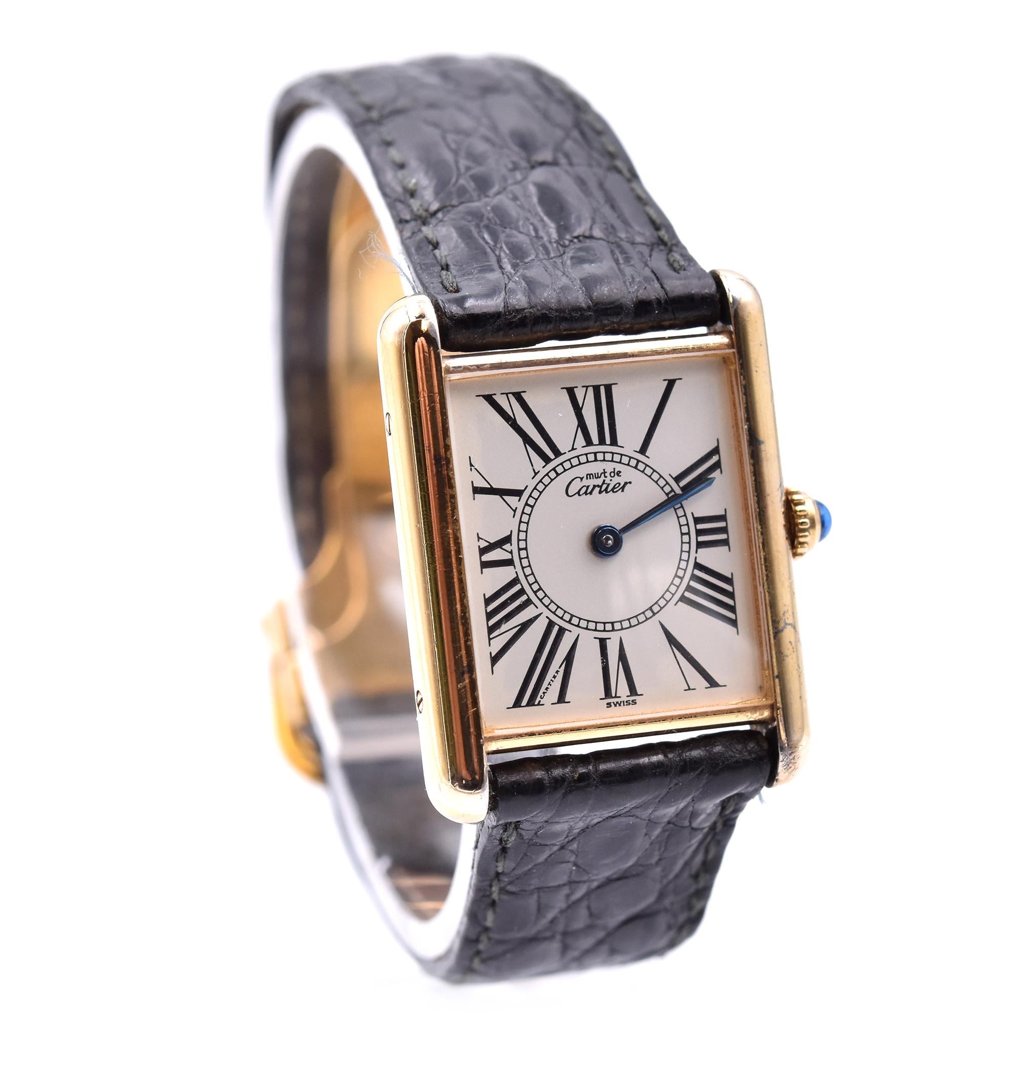 Movement: quartz
Function: hours, minutes
Case: 31mm X 24mm case, push pull crown, sapphire crystal
Dial: white roman dial
Band: black Cartier leather strap with Cartier stainless steel deployment clasp
Serial #: 590XXX
Reference: 92747

Does not