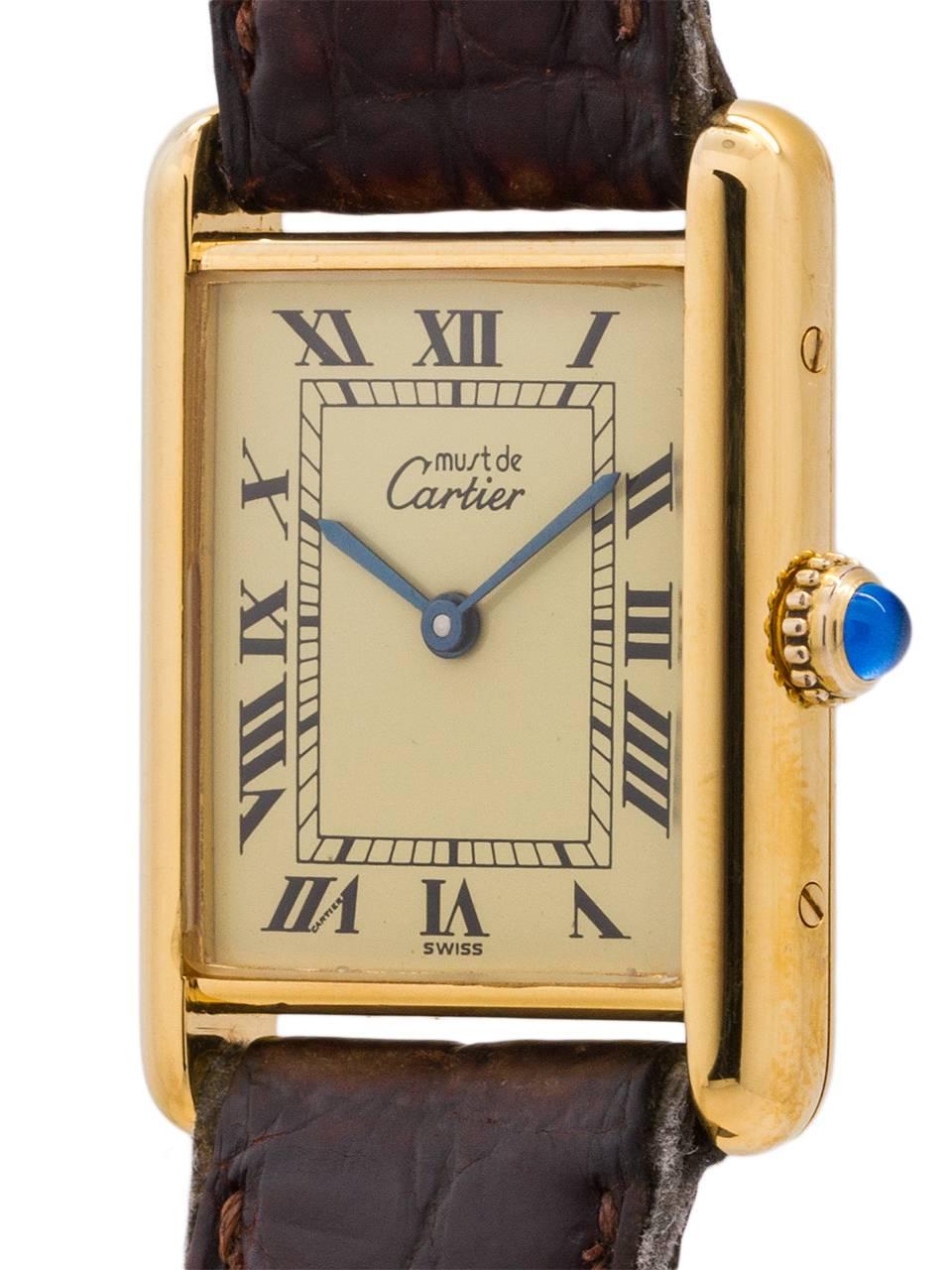 
Cartier Man’s Tank Louis circa 1990s. Featuring 24 x 30mm vermeil (20 microns gold over silver) case secured by 4 side and 4 case back screws. Featuring classic cream color dial signed Must de Cartier with printed black Roman numerals and blued