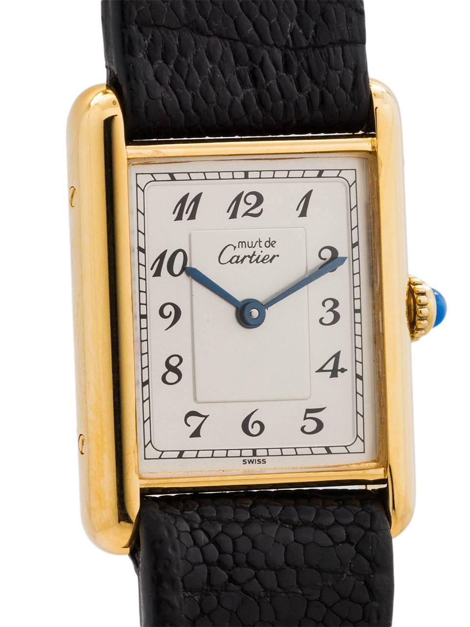 
Cartier man’s vermeil Tank Louis circa 1990s. Featuring a 23.5 X 31mm case secured by 4 side and 4 caseback screws. Featuring original, beautiful, silver dial with sunken breguet numerals, and signed Must de Cartier, with blued steel hands, and