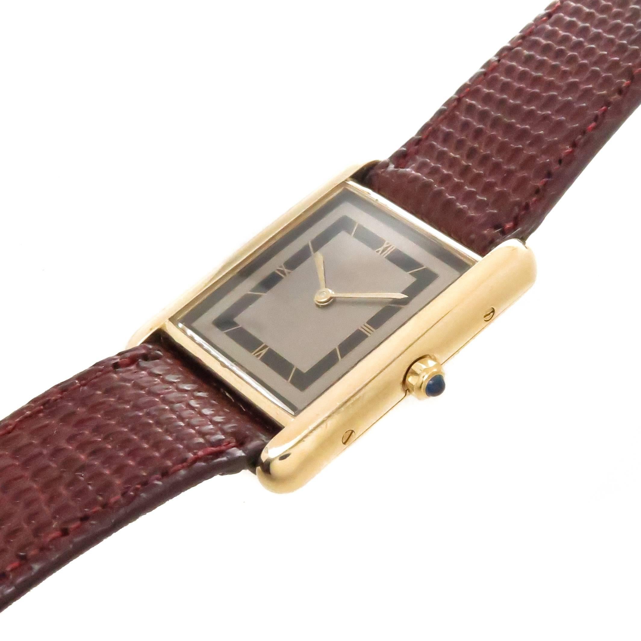 Circa 2000 Cartier Classic Tank Wrist Watch, 30 X 23 MM Vermeil ( Gold Plate on Sterling Silver ) Case. Quartz Movement 
 and a sapphire Crown. This watch features the very hard to find Gray dial with Black inner Track. Original Cartier Burgundy