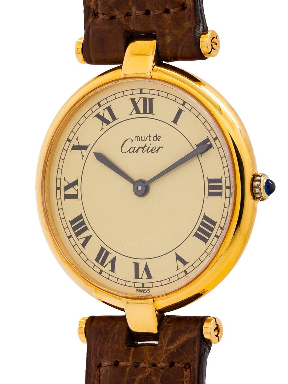 
Cartier man’s vermeil Vendome Tank wristwatch circa 1990s. Case measuring 30 x 37mm with T-bar lugs. Featuring an original cream dial with classic printed Cartier Roman numbers with blued steel hands and blue sapphire cabochon crown. Battery