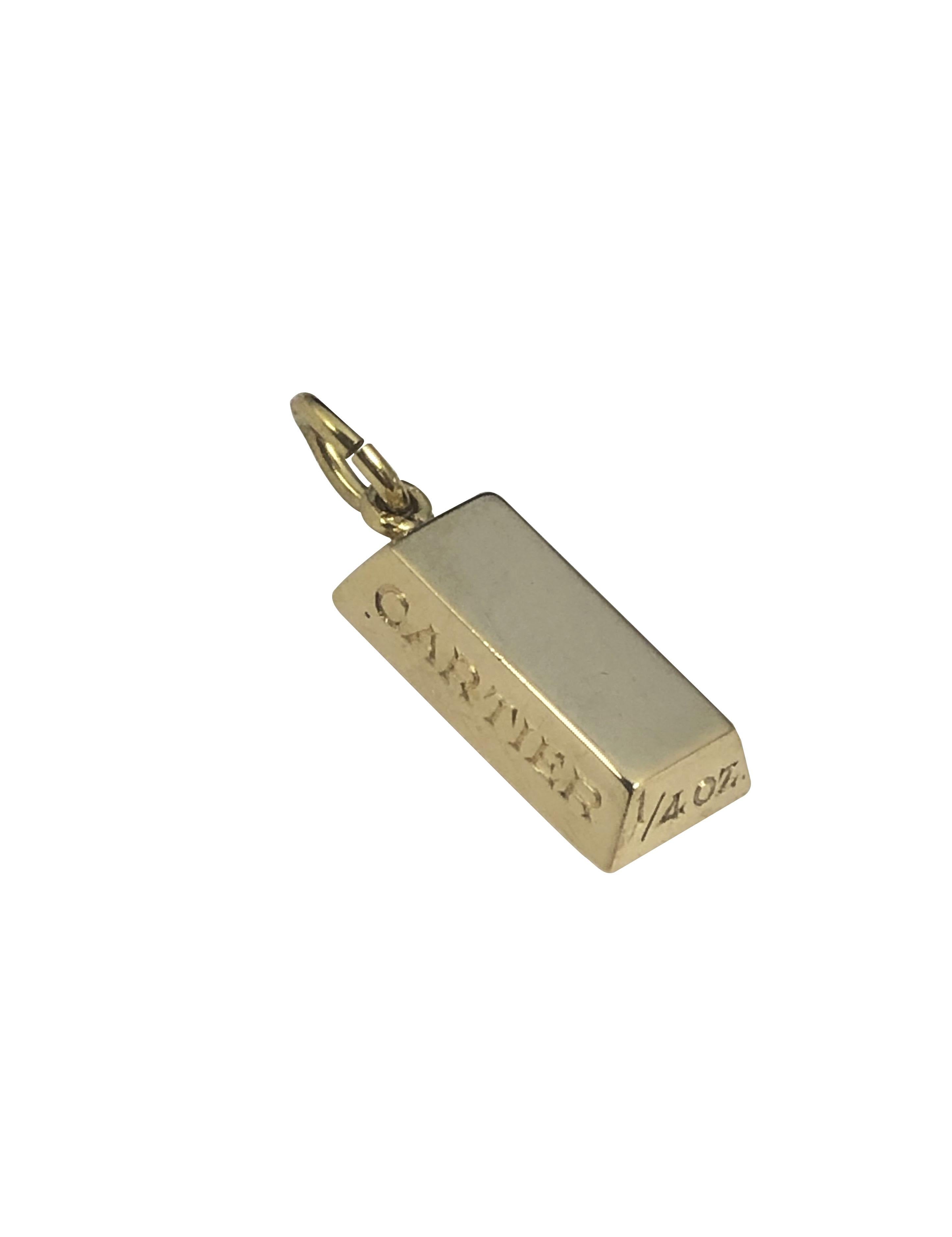 Circa 1980s Cartier 1/4 Ounce 18k Yellow Gold Ingot charm, measuring 5/8 X  5/16 inch. Comes in the original Cartier presentation box.