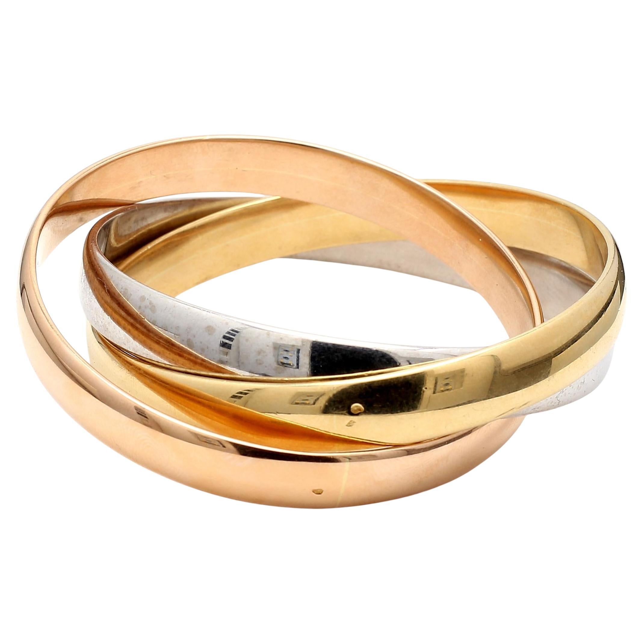 Cartier Vintage 102.40 Grams Size 7.5 Inch 18 Karat Gold Bangle Trinity Bracelet