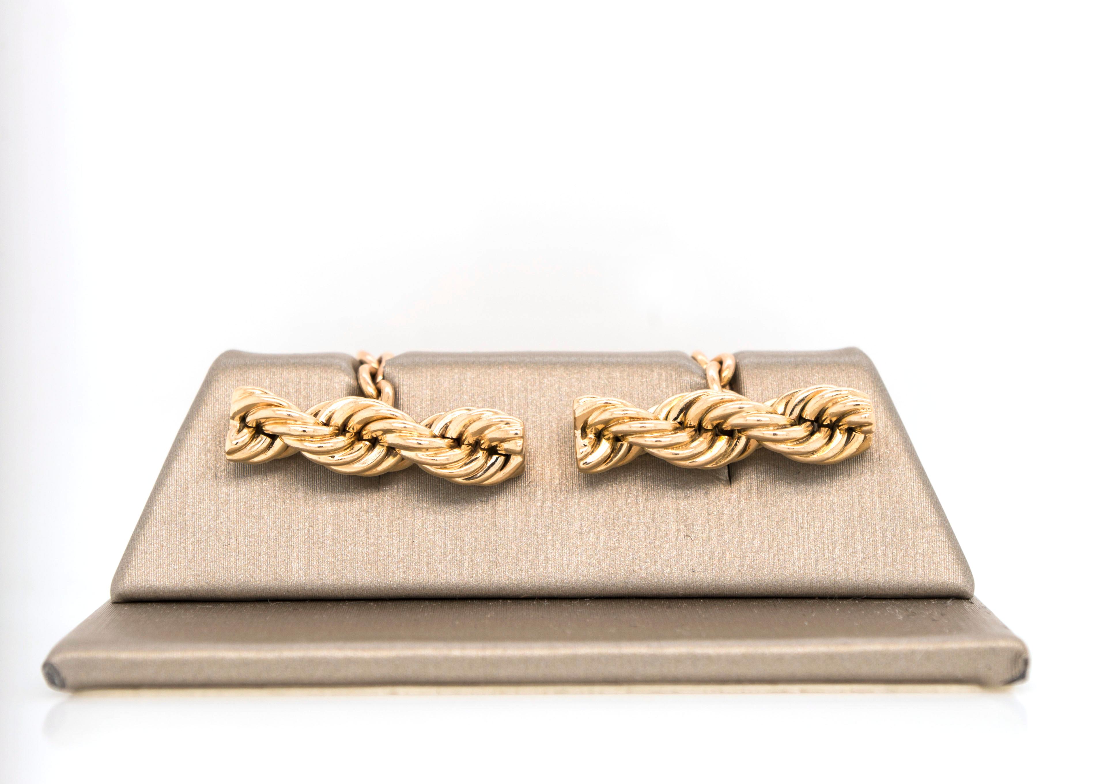 Iconic Twisted Rope Chain by Cartier.  Simple and elegant, these twisted rope cufflinks in 14k yellow gold
will elevate your style any day of the week. Chain link closure.
Very good condition.
Signed 