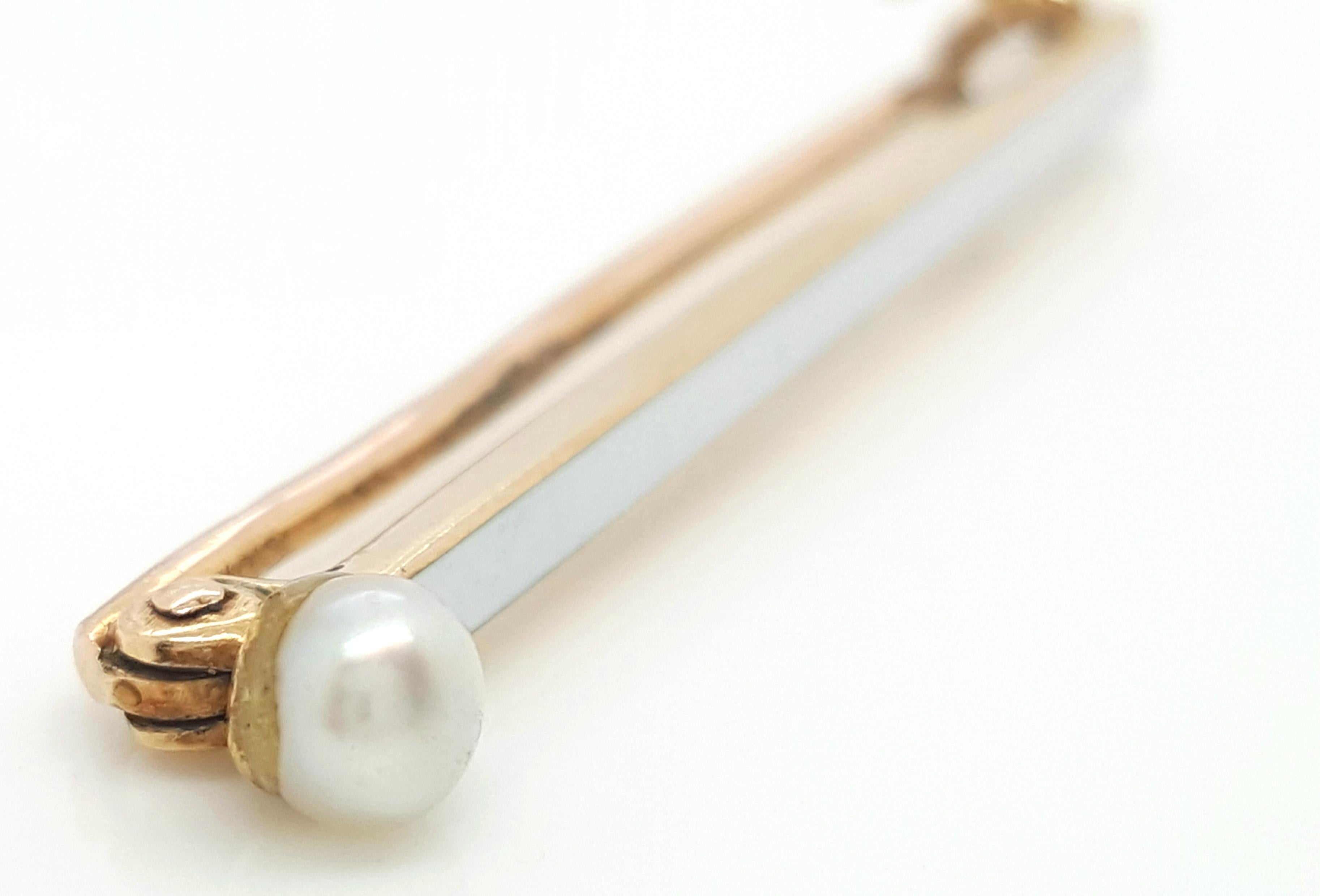 Vintage Art Deco 14 Karat Yellow Gold Pearl Bar Brooch. This chic brooch features pearl that are the perfect feminine accent, all are set in 14 karat yellow gold, completed by a pinstem and catch, on the reverse. Brooch weighs 2.9 grams. 