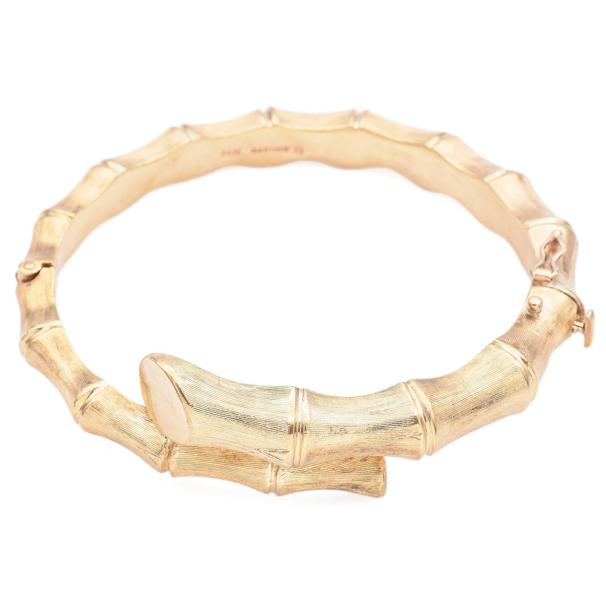 The piece is a creation by Cartier, showcasing meticulous attention to detail. A distinctive bangle bracelet designed to resemble bamboo segments. Crafted in 14k yellow gold, the textured surface mimics the natural look of bamboo.

Weight: 32.2