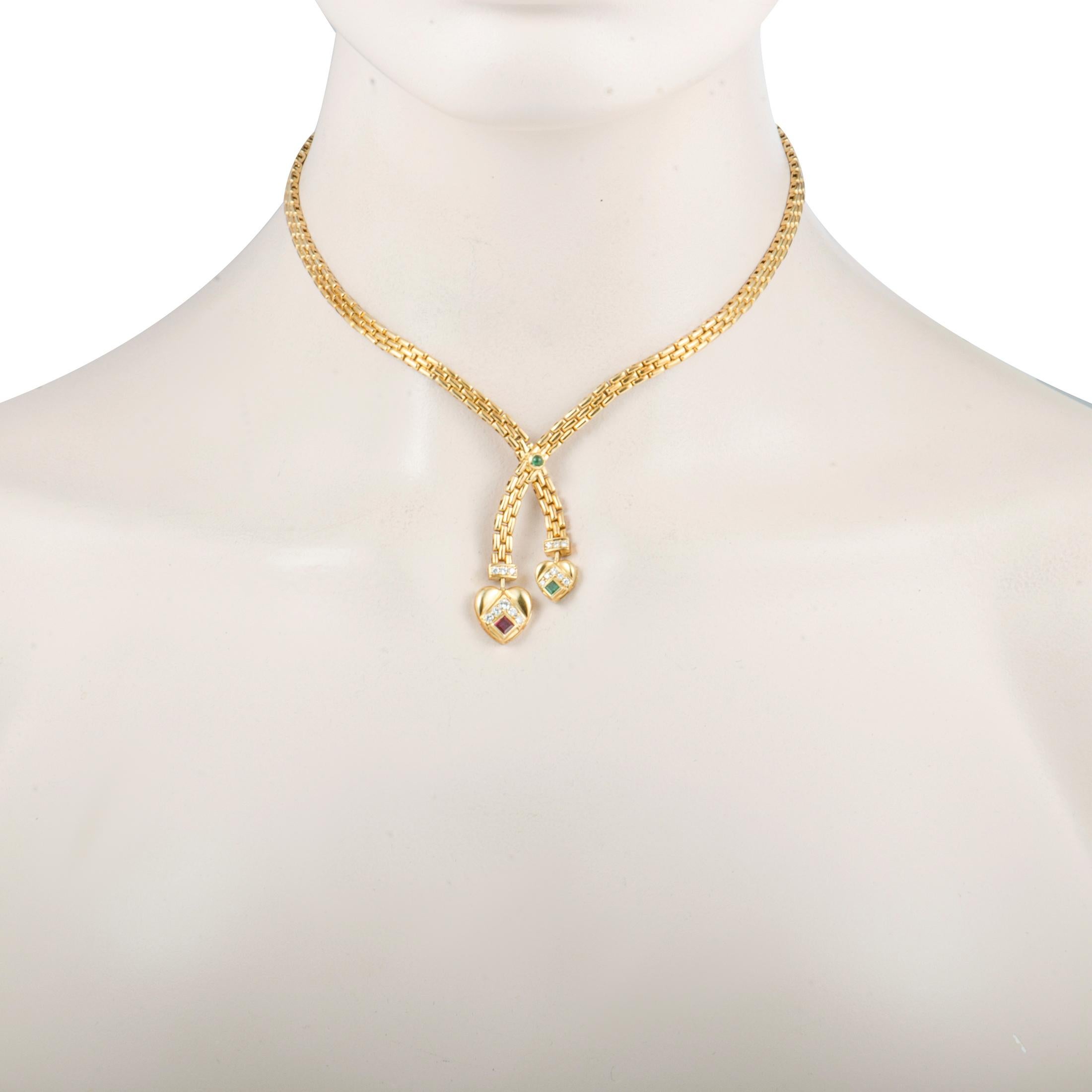 This exquisitely vintage necklace by Cartier emanates utmost elegance through its remarkably unique design. The beautiful necklace is crafted from classy 18K yellow gold and embellished with captivating rubies, alluring emeralds, and glamorous