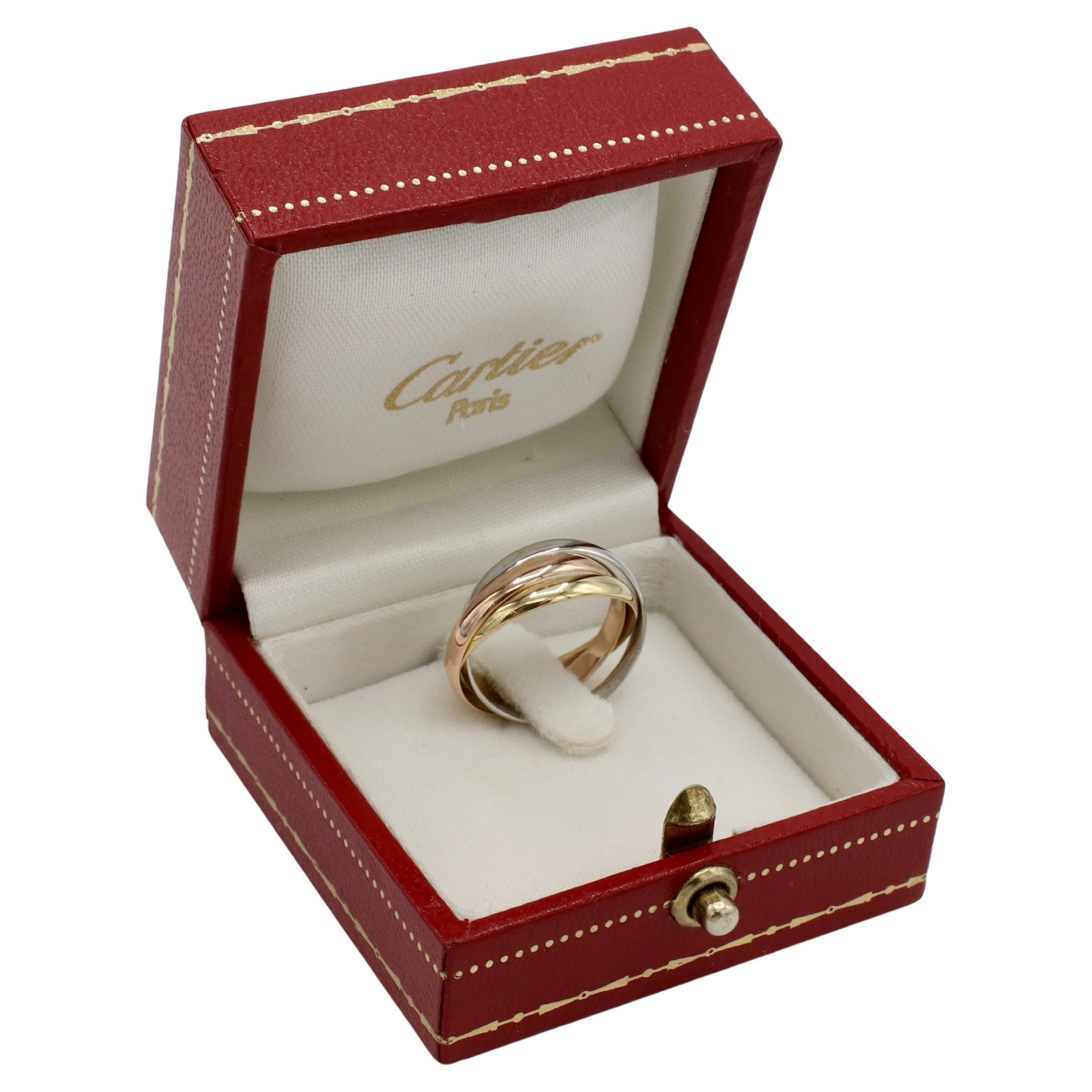 Cartier Vintage 18 Karat Yellow Gold Tri-Color Trinity Rolling Band Ring 
Metal: 18 karat yellow, white & rose gold
Band with: 2.5mm each, approx. 3.5 - 7.5 stacked
Size: 50 (5.25 US)
Signed: 750 Cartier 50 AJ315
Weight: 3.95 grams