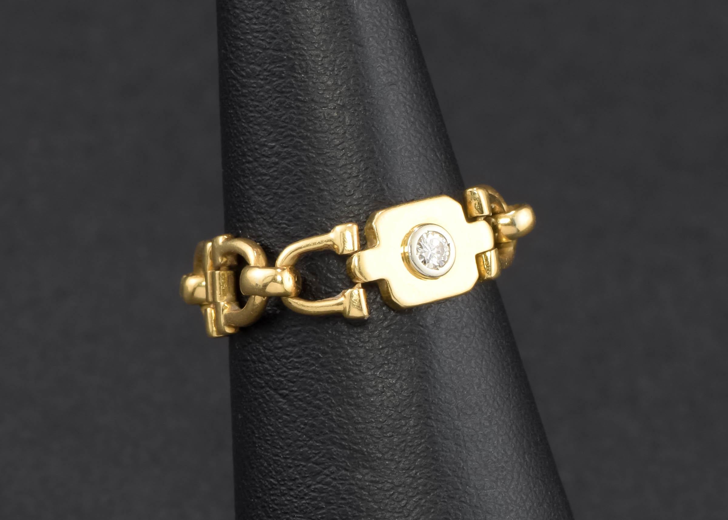 For my fellow horse lovers, is this wonderful vintage Cartier Equestrian Horse Bit Link Ring dating to the 1980's....

Crafted of 18K gold, the ring features a really neat articulated/hinged link design of gold horse bits, with a central plaque set