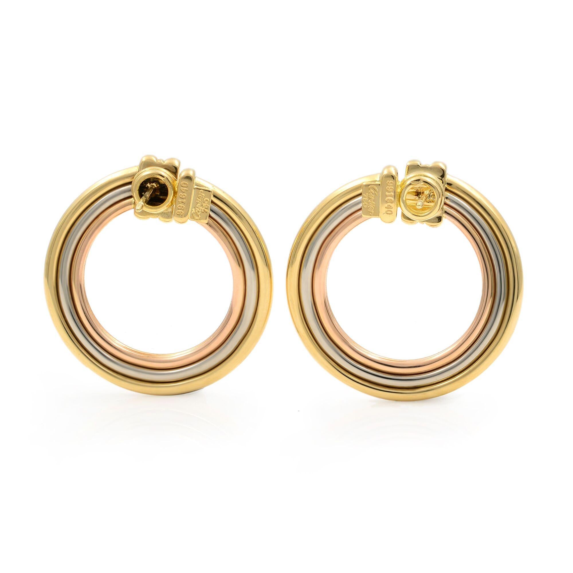 1970's Cartier Vintage Large Circle Earrings in 18 Karat white, yellow and pink gold. The large circles measure 30 x 30mm, and are signed Cartier 750, serial numbered and hallmarked. very trendy and fashionable. The earrings are in an excellent