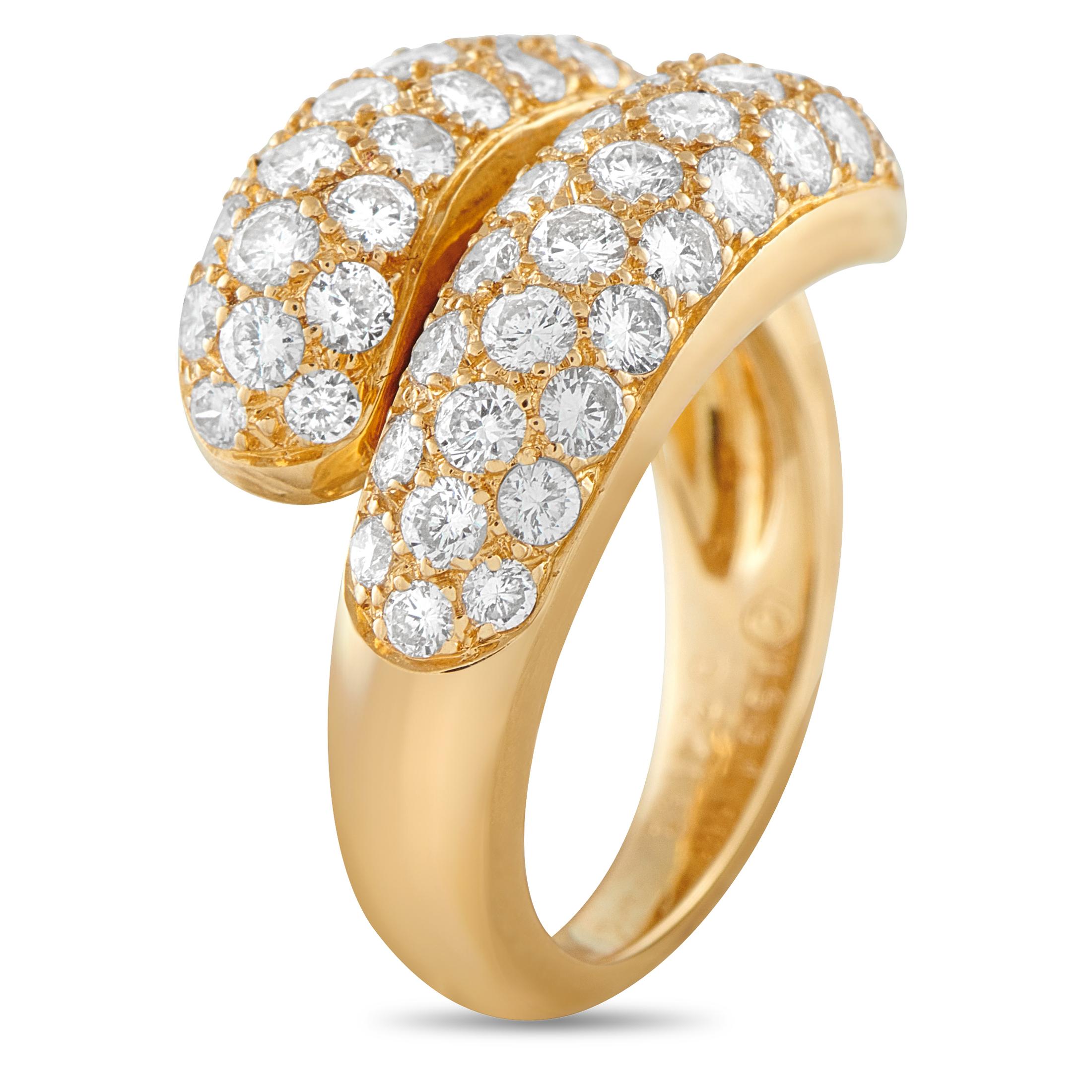 This vintage Cartier bypass ring is incredibly chic. Set in 18K Yellow Gold, the stylish wrapped setting comes to life thanks to inset Diamonds totaling 2.41 carats. Sleek, sophisticated, and ideal for any occasion, it features a 2mm wide band and a