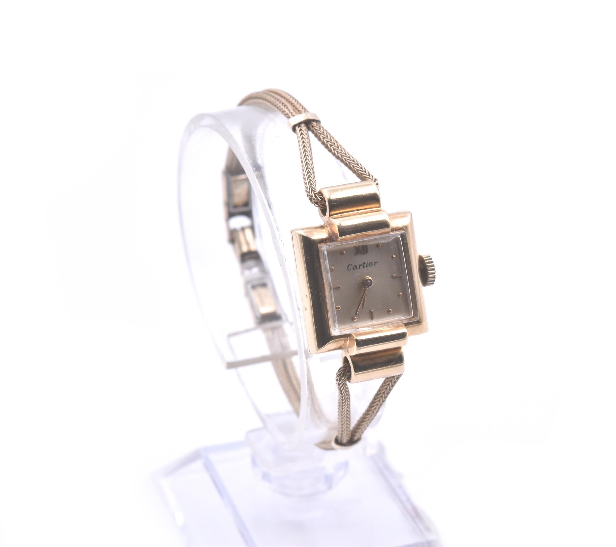 Movement: mechanical
Function: hours, minutes
Case: square 17.76mm 18k yellow gold case, plastic protective crystal, pull/push crown 
Dial: gold dial, gold tone hands, gold tone hour markers
Band: double wheat chain bracelet with jewelry fold over
