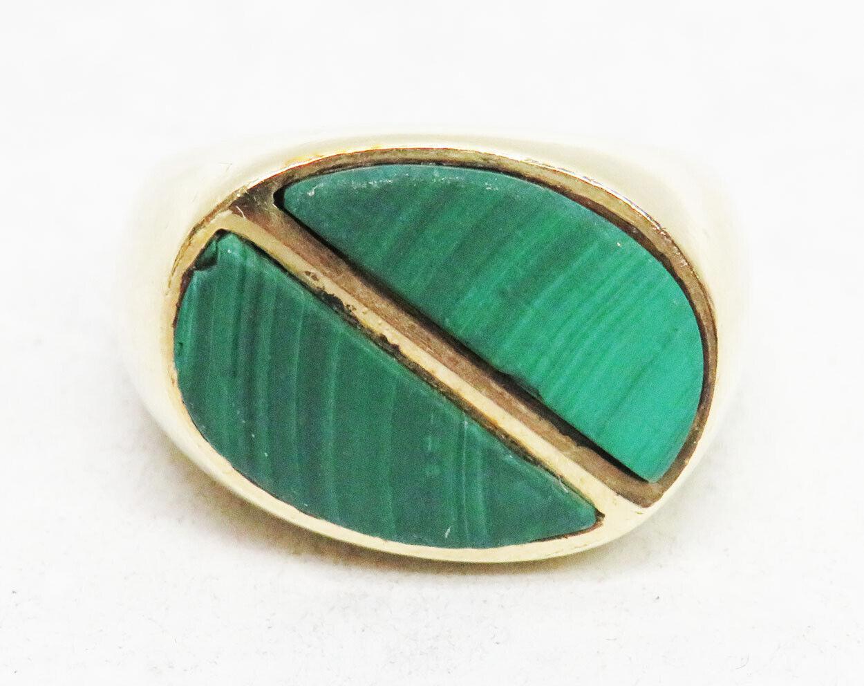Cartier Vintage 18k Yellow Gold & Malachite Cocktail Ring Fully Hallmarked Circa 1970s

Here is your chance to purchase a beautiful and highly collectible designer cocktail ring.  

Cartier Vintage 18k Yellow Gold & Malachite Cocktail Ring
Metal