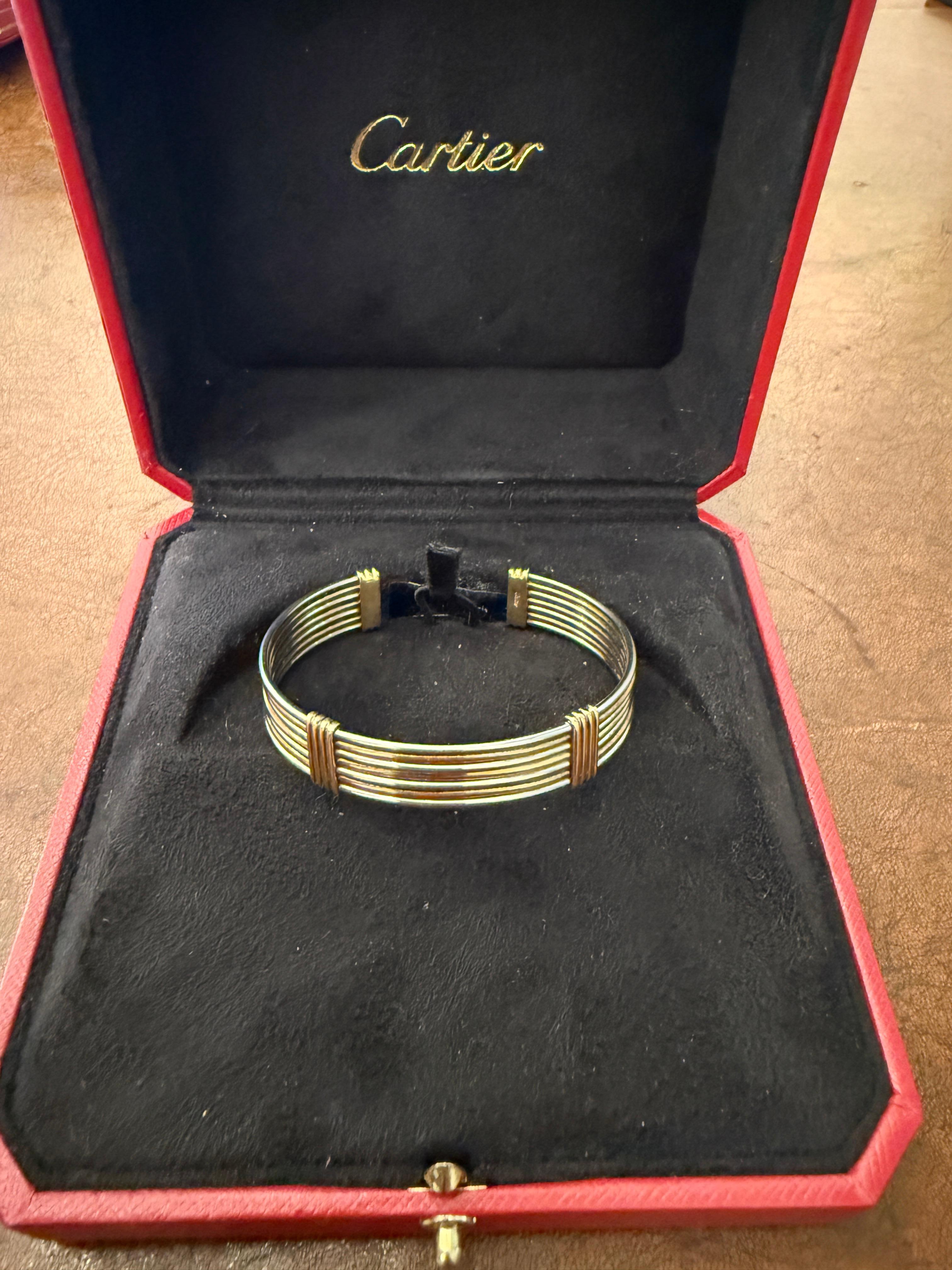 Embrace timeless elegance with this exquisite vintage steel and gold jewelry set from Cartier. Crafted with precision and attention to detail, these stunning Cartier  bracelet exude a sense of sophistication and charm that transcends eras.

The