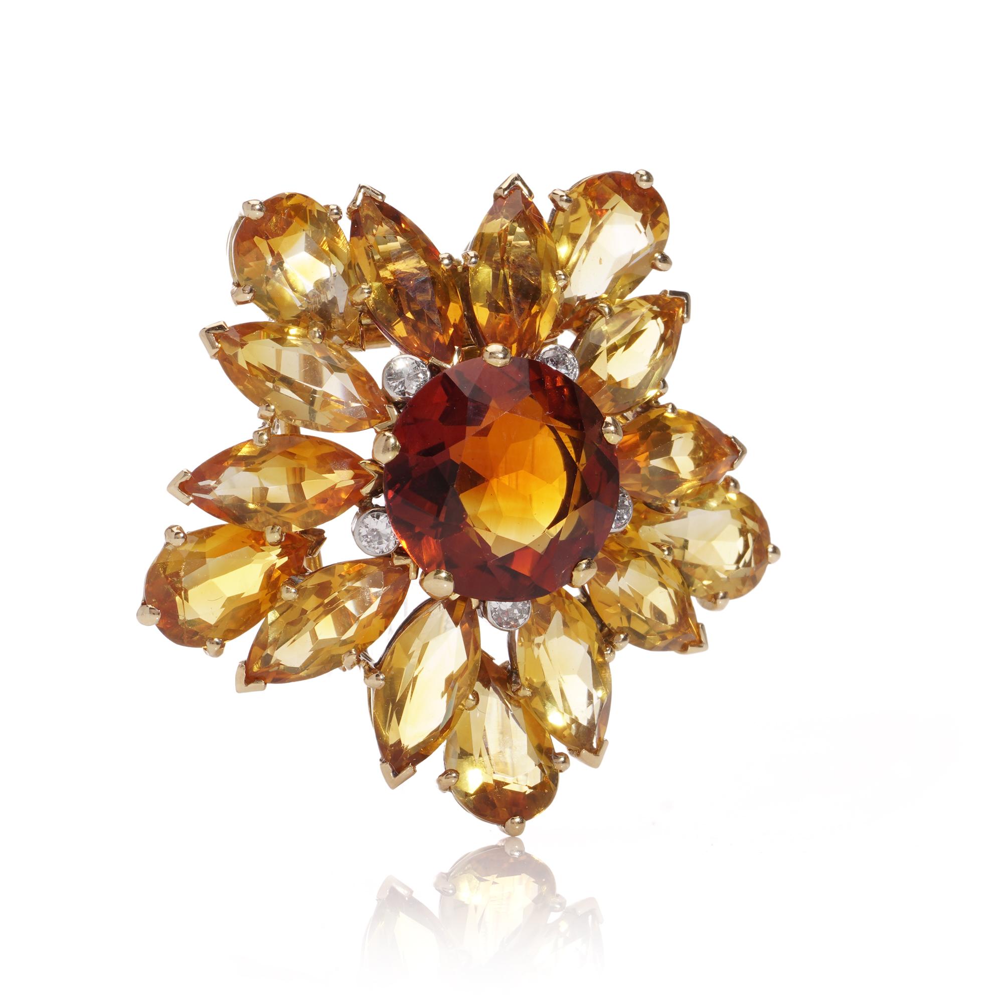 Cartier vintage 18kt. yellow gold sunflower clip brooch. 
Crafted in 18k yellow gold, it features a striking 10.00-carat Spessartine garnet at its centre,  complemented by imperial topaz petals and accented with 5 round brilliant diamonds.