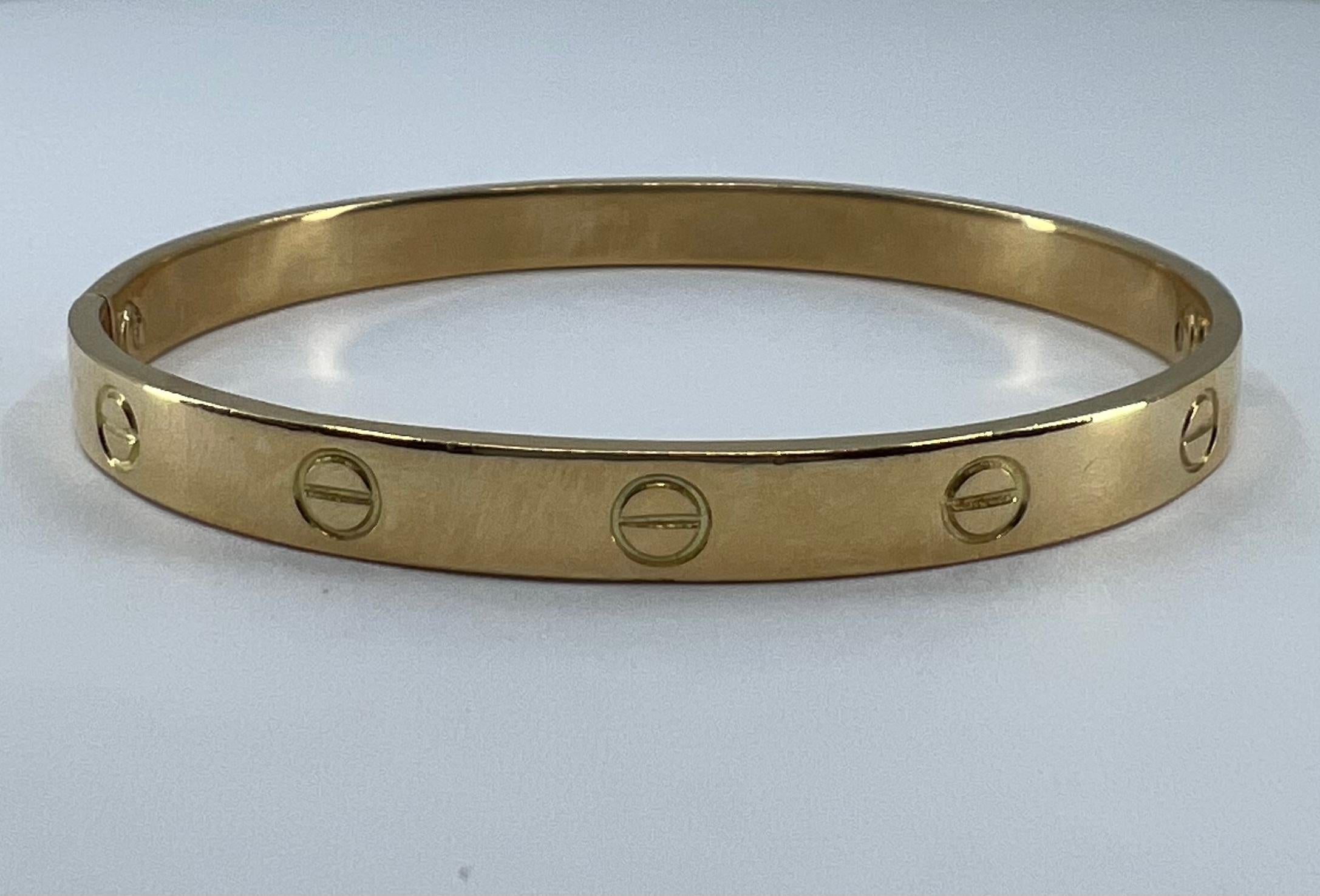 A vintage Cartier 18k gold Love bracelet from the 1970 (stamped).

Being a symbol of commitment, a Love bracelet was designed as a minimalistic piece in 1969 and was bound to become iconic.

The Cartier Love bracelet is supposed to be put on by