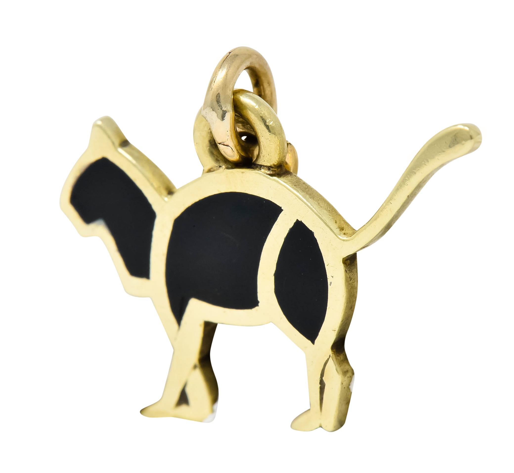 Charm designed as a stylized cat with three geometric areas of black enamel

Enamel is flat with a glossed finish and exhibits no loss; consistent with age wear and use

Completed by jump ring bale

Fully signed Cartier

Stamped 14K for 14 karat