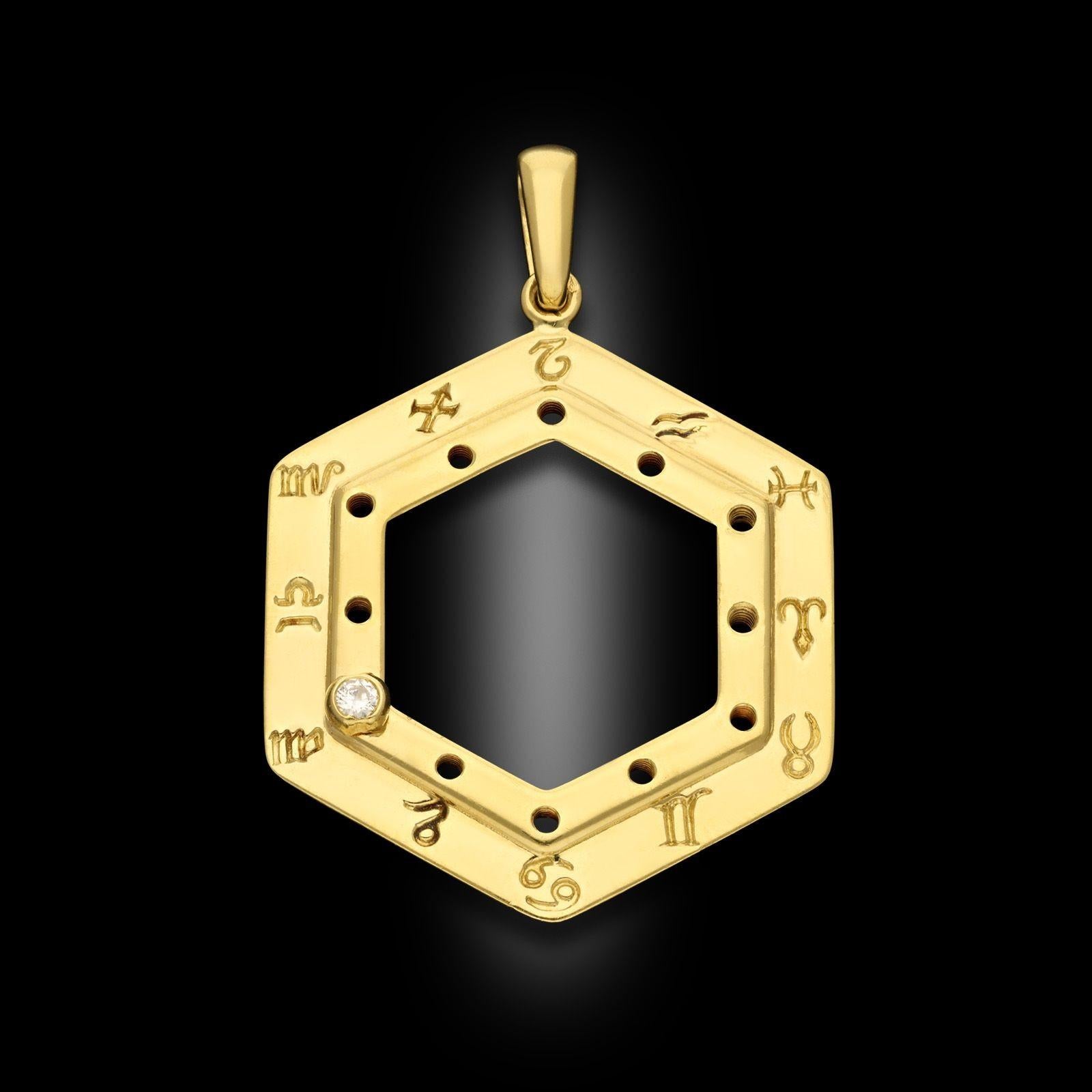 A vintage Cartier zodiac pendant circa 1990. This hexagonal 18ct yellow gold pendant has all 12 zodiac signs engraved around the edge and has a bezel set round brilliant cut diamond with a screw fixture which can be moved and placed on your zodiac