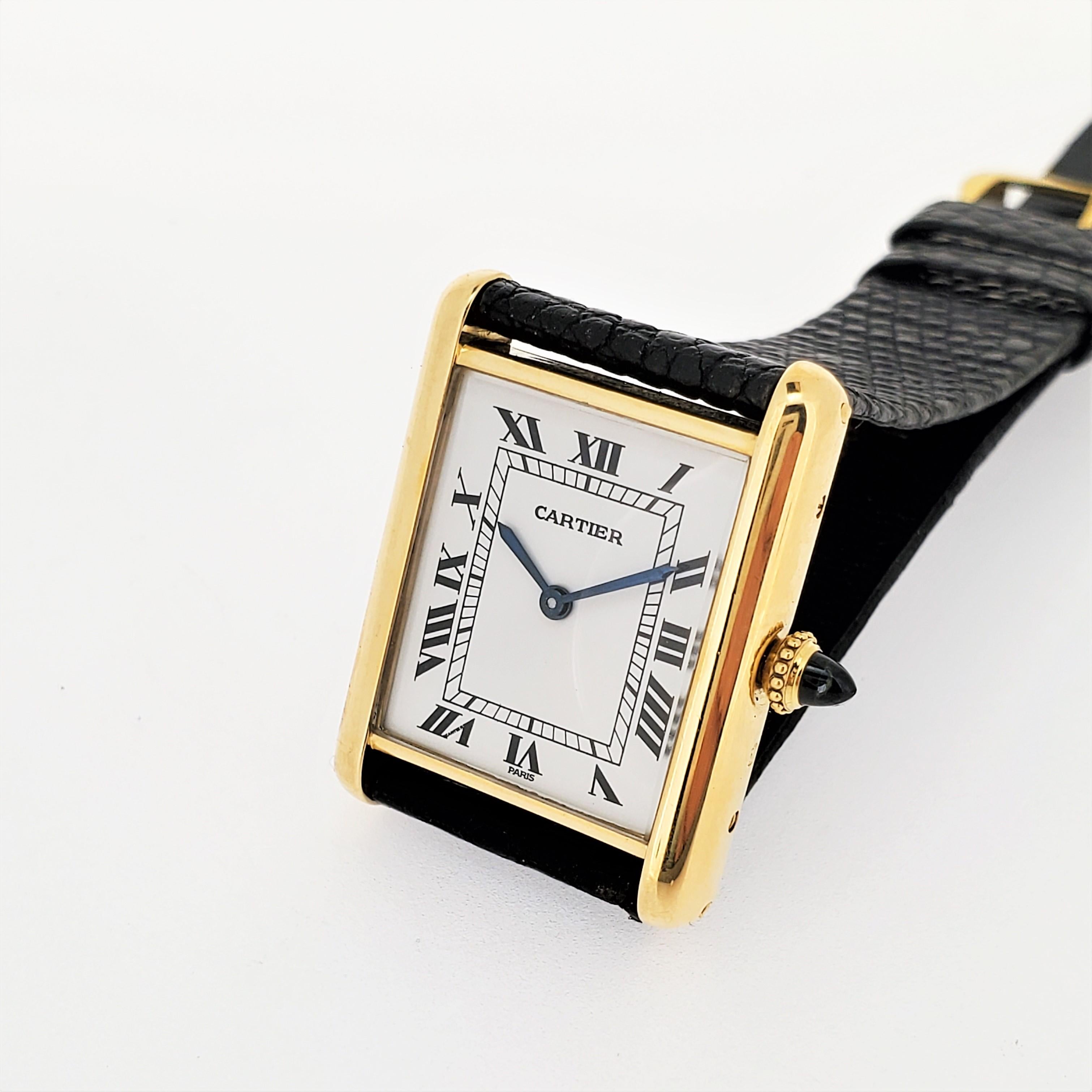 Introduction:
This Vintage Cartier Paris Tank Watch is made in 18 Karat yellow gold and measures 30 x 25 mm with a 17-Jewel Cartier  mechanical manual wind movement.  It has the original black lizard strap with 18K Cartier buckle.  It is triple